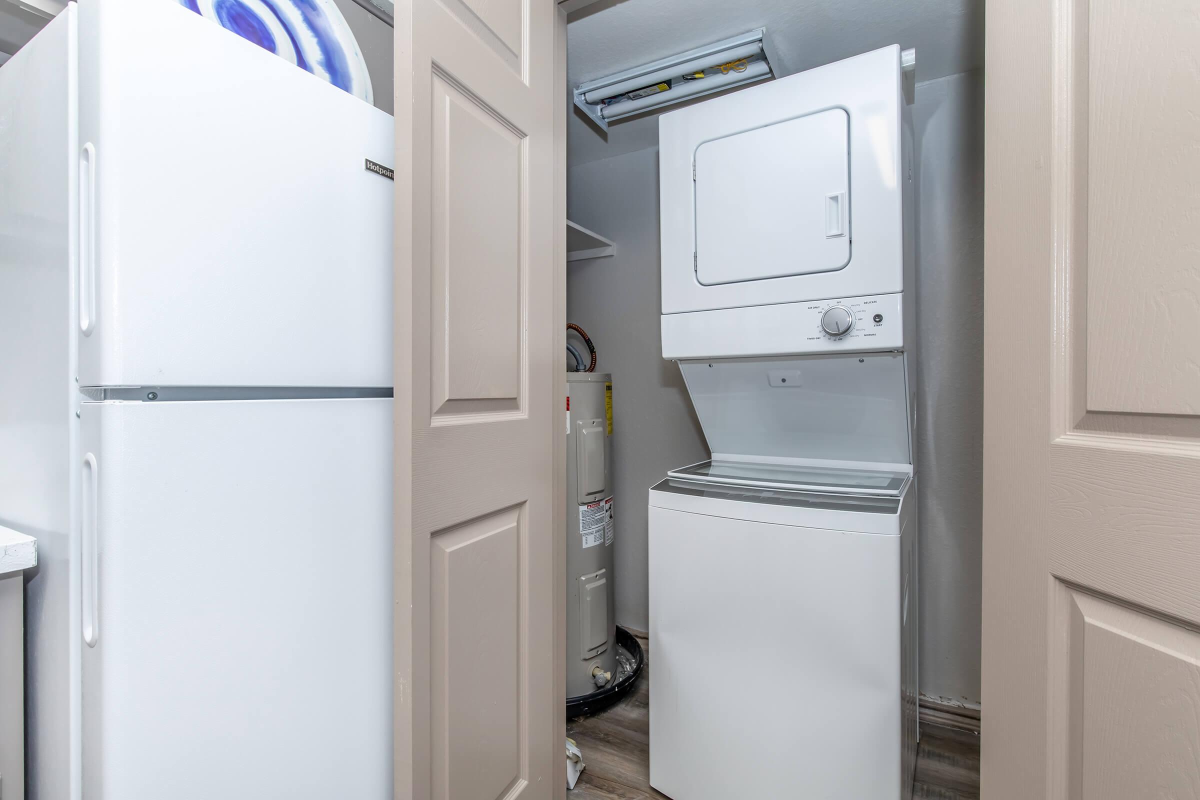 a refrigerator freezer sitting inside of a kitchen