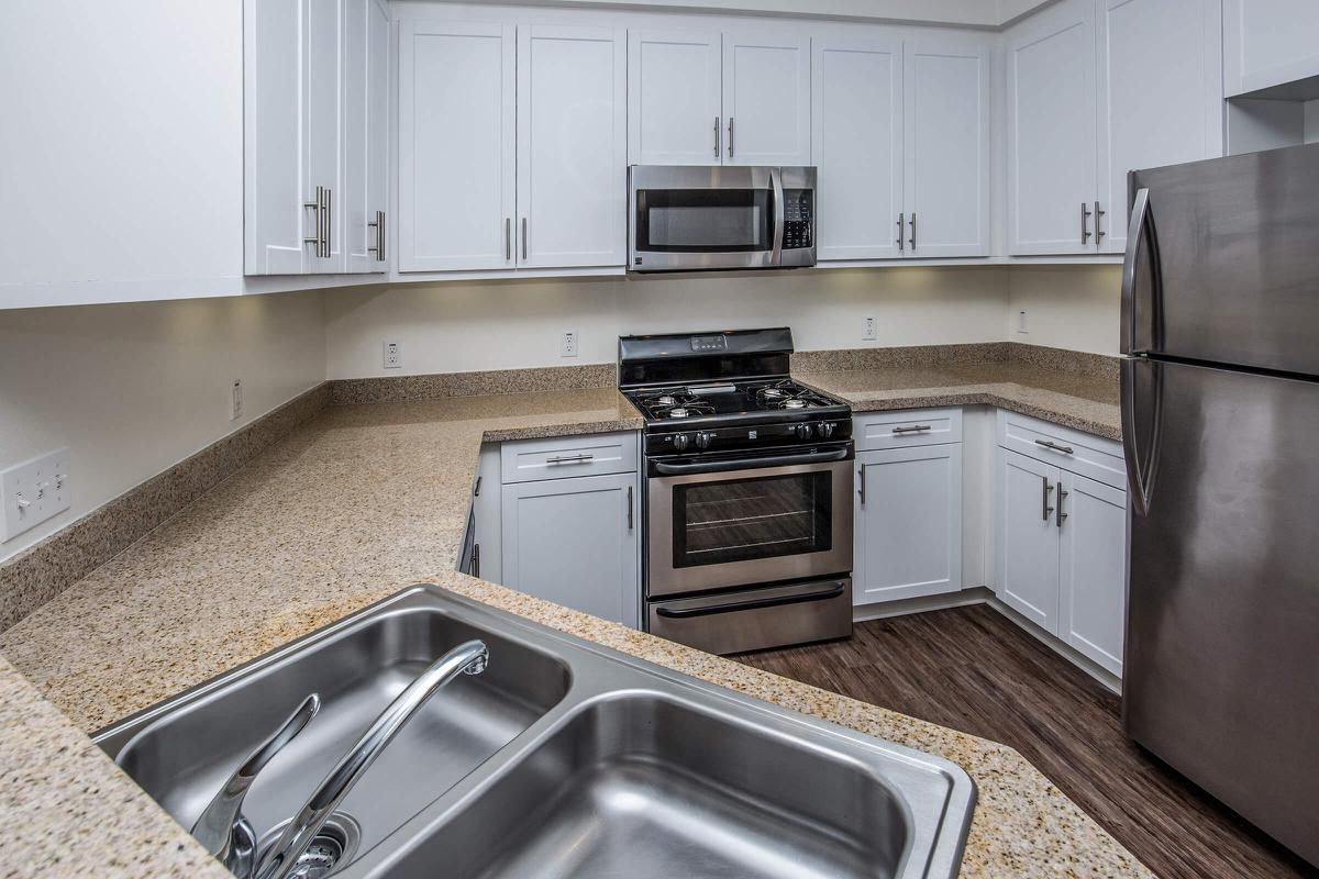 a modern kitchen with stainless steel appliances