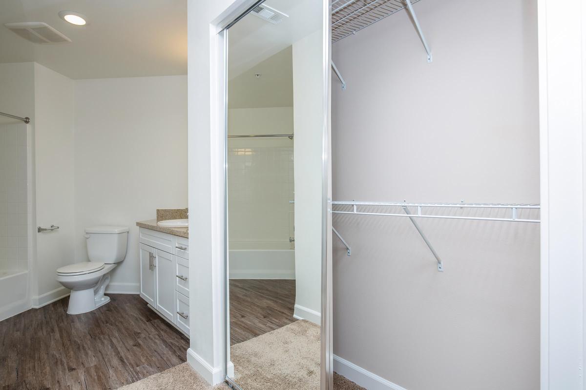 a large white tub sitting next to a shower