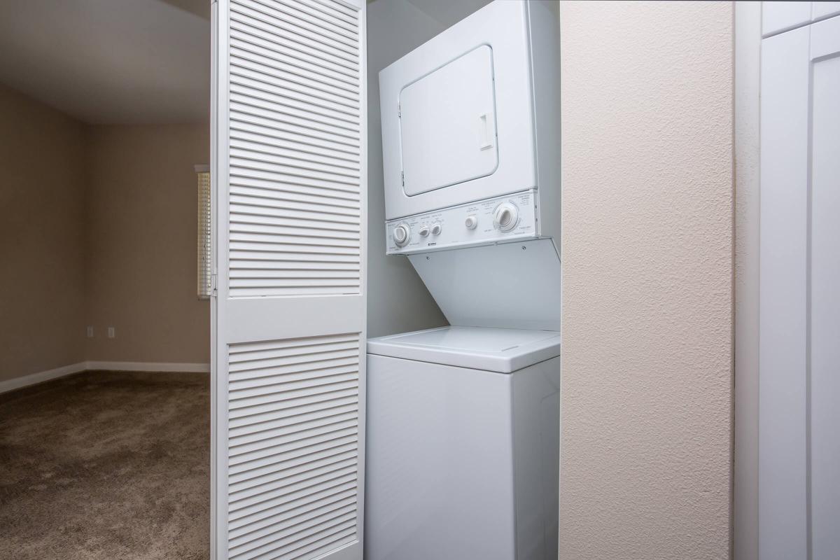 a white refrigerator freezer sitting next to a door