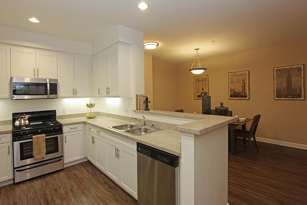 a large kitchen with stainless steel appliances