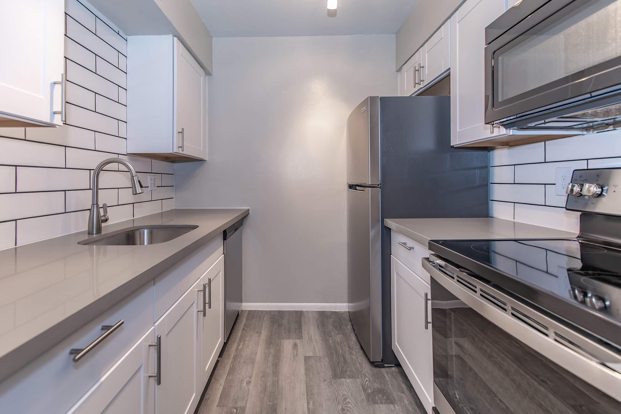 a kitchen with a sink and a window