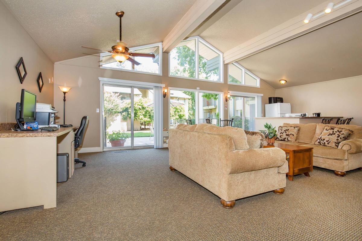 a living room filled with furniture and a fireplace