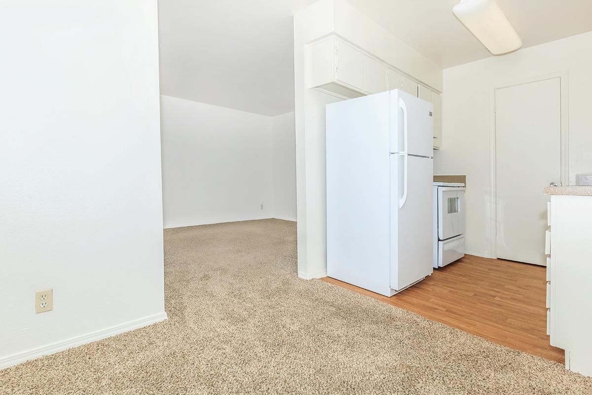 a white refrigerator freezer sitting inside of a kitchen