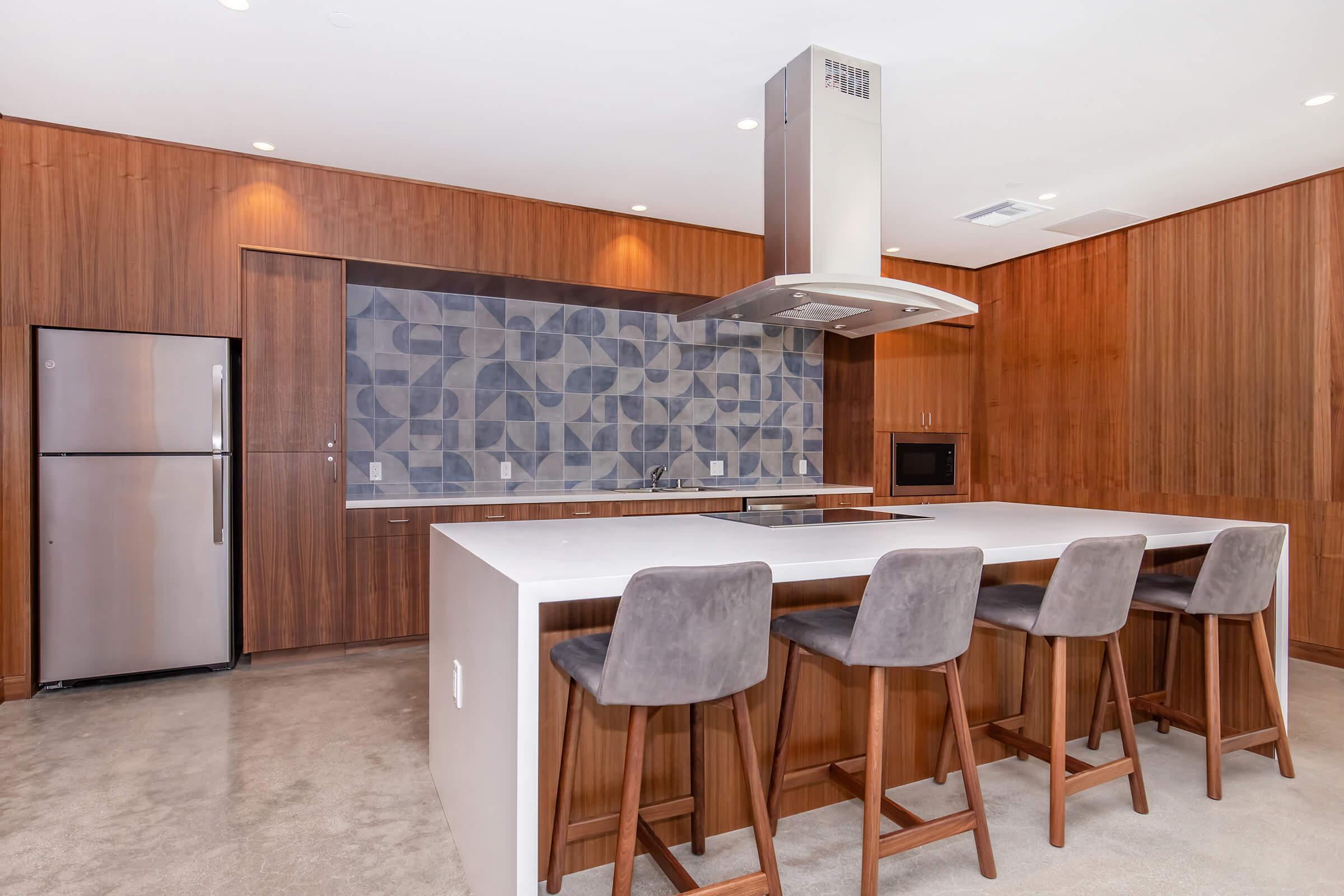 a kitchen with an island in the middle of a room