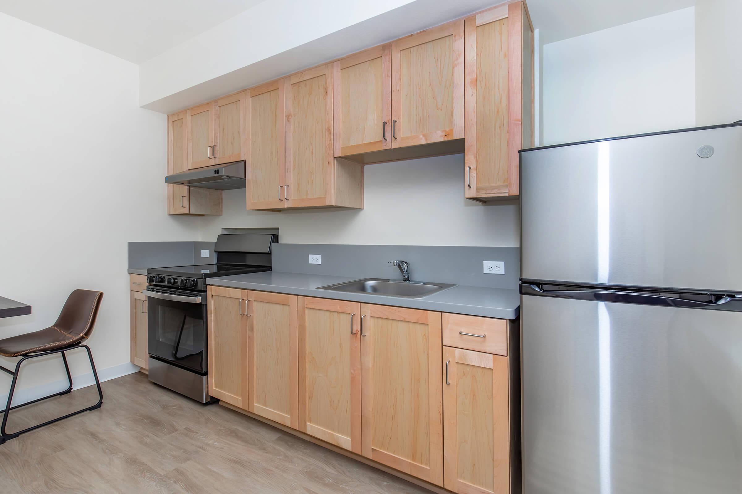 a kitchen with a stove and a refrigerator