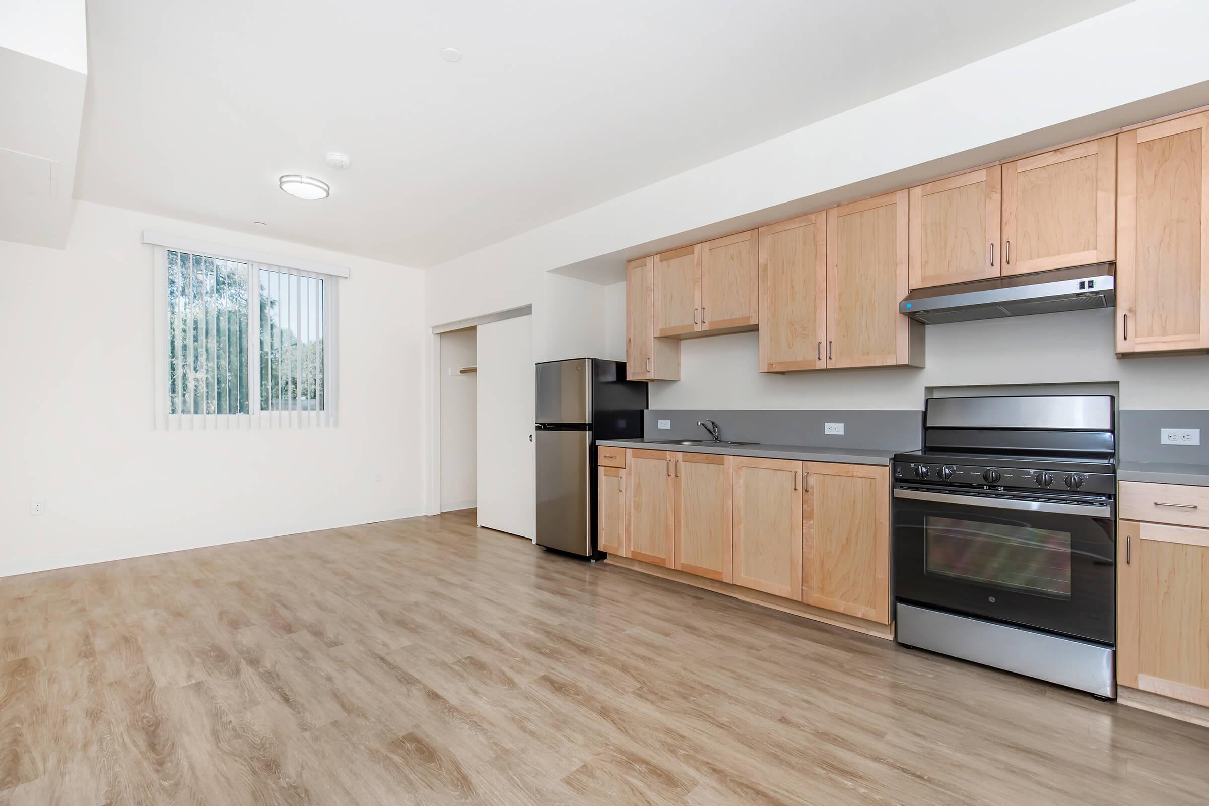 a kitchen with a wood floor