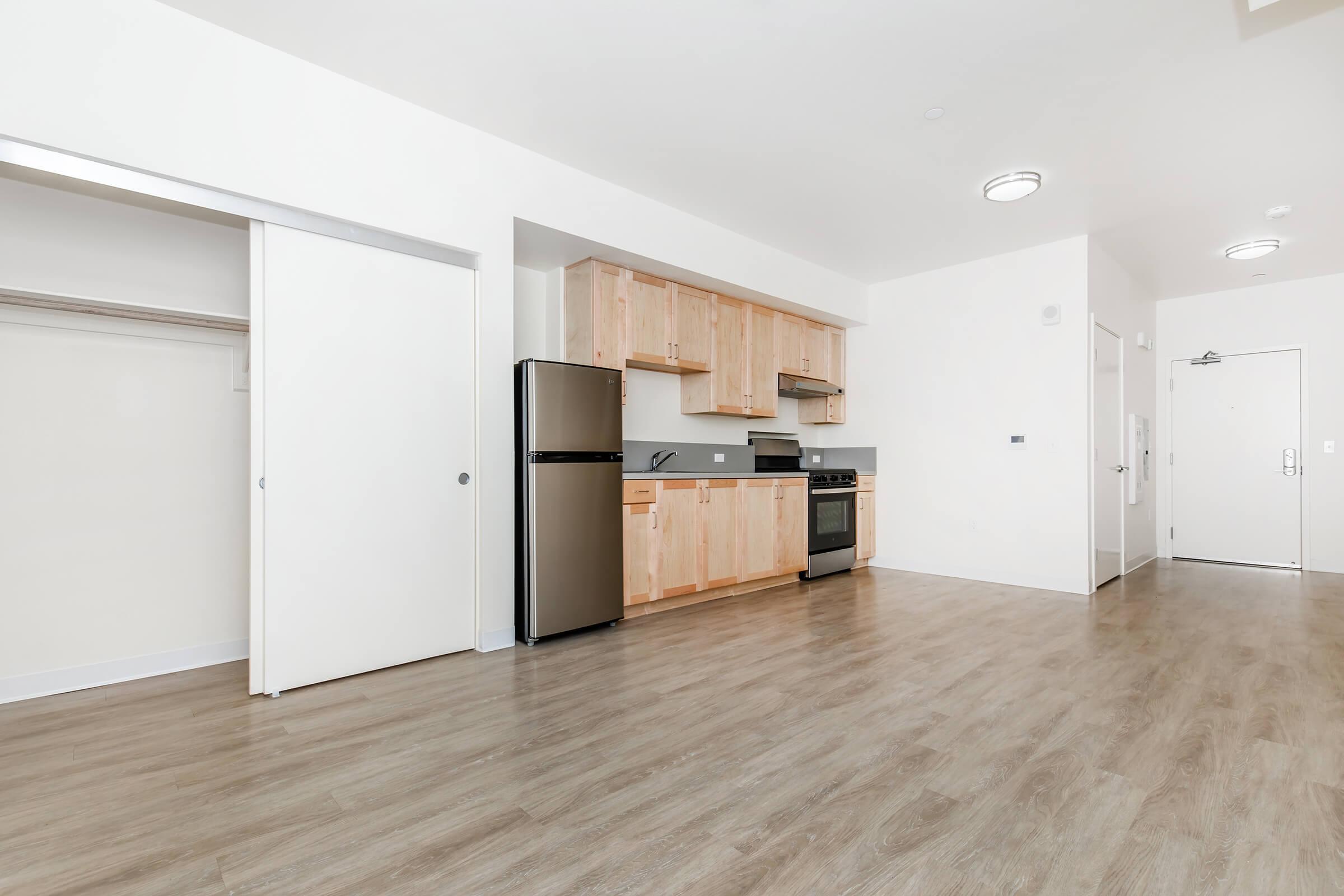 a kitchen area with a building in the background