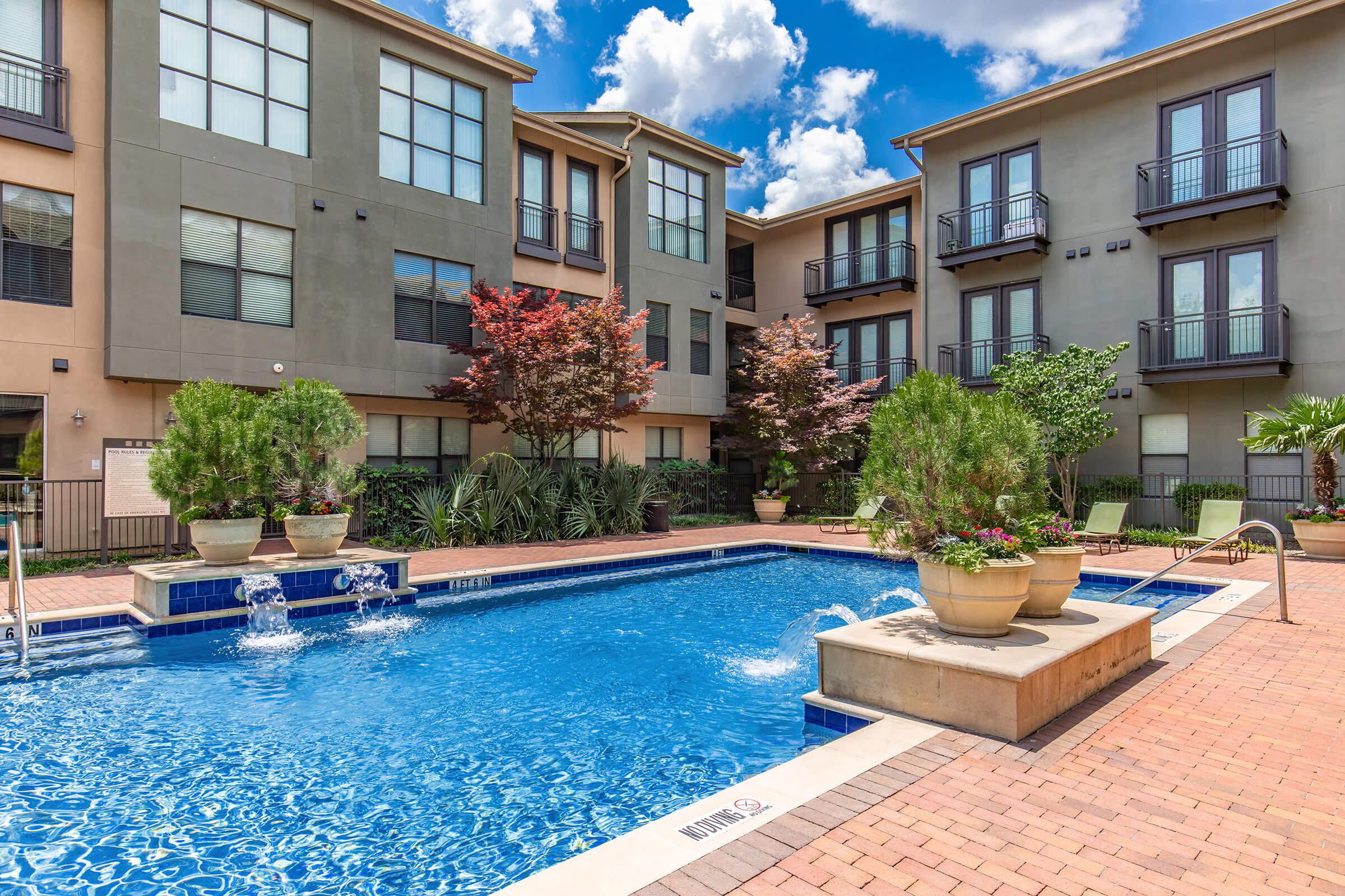 a large pool of water in front of a building