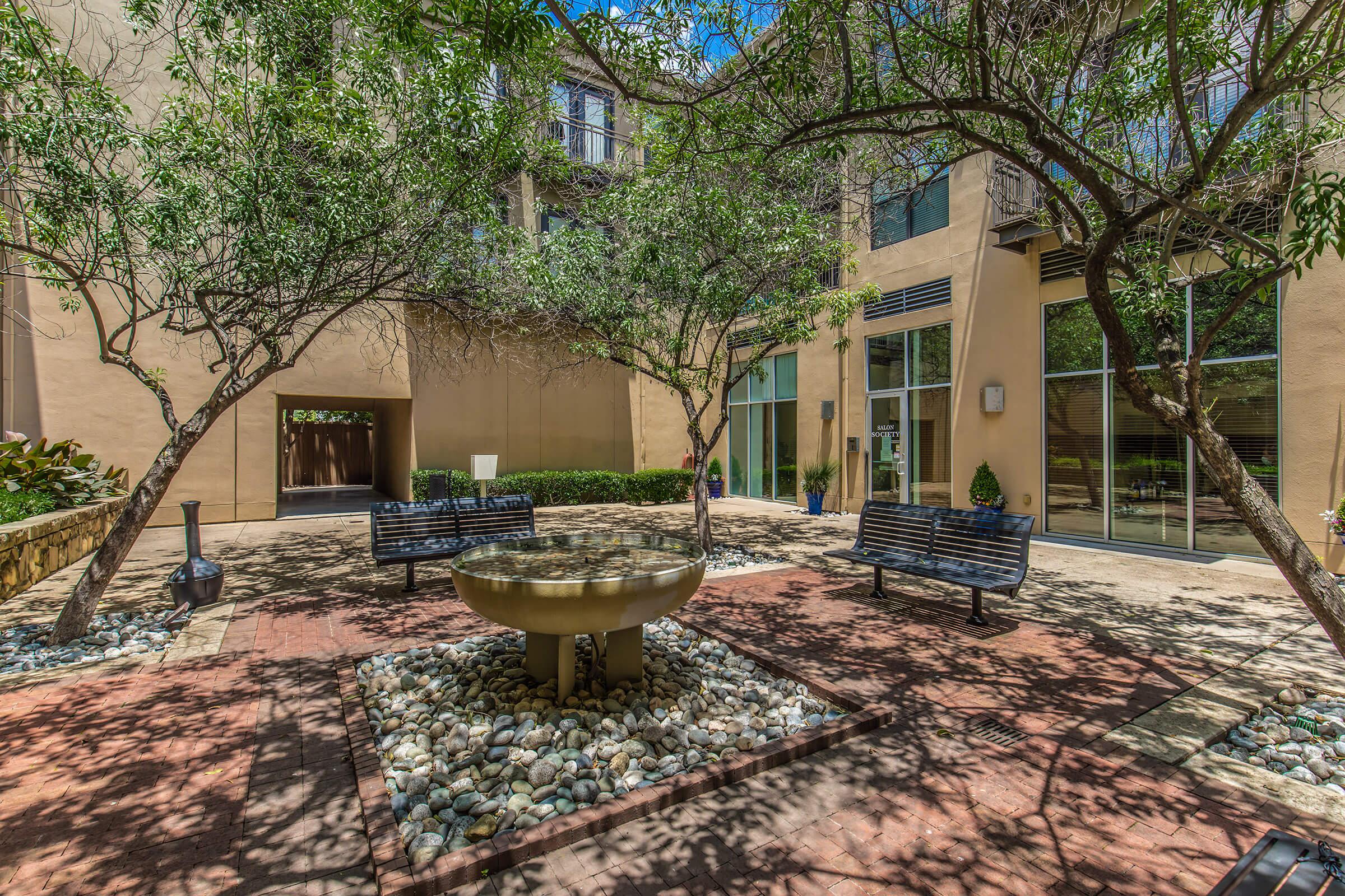 a tree in front of a building