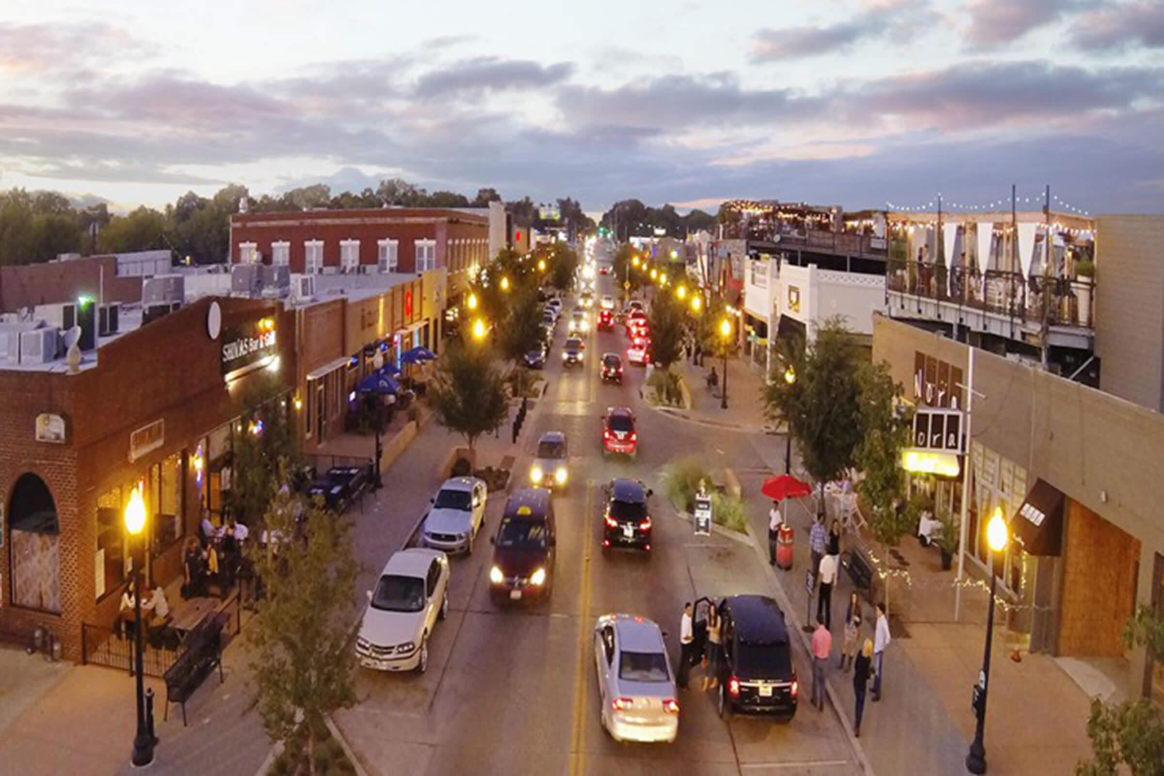 a view of a city street filled with lots of traffic