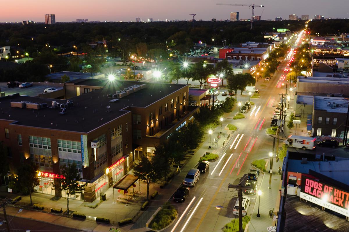 a view of a city street filled with traffic at night