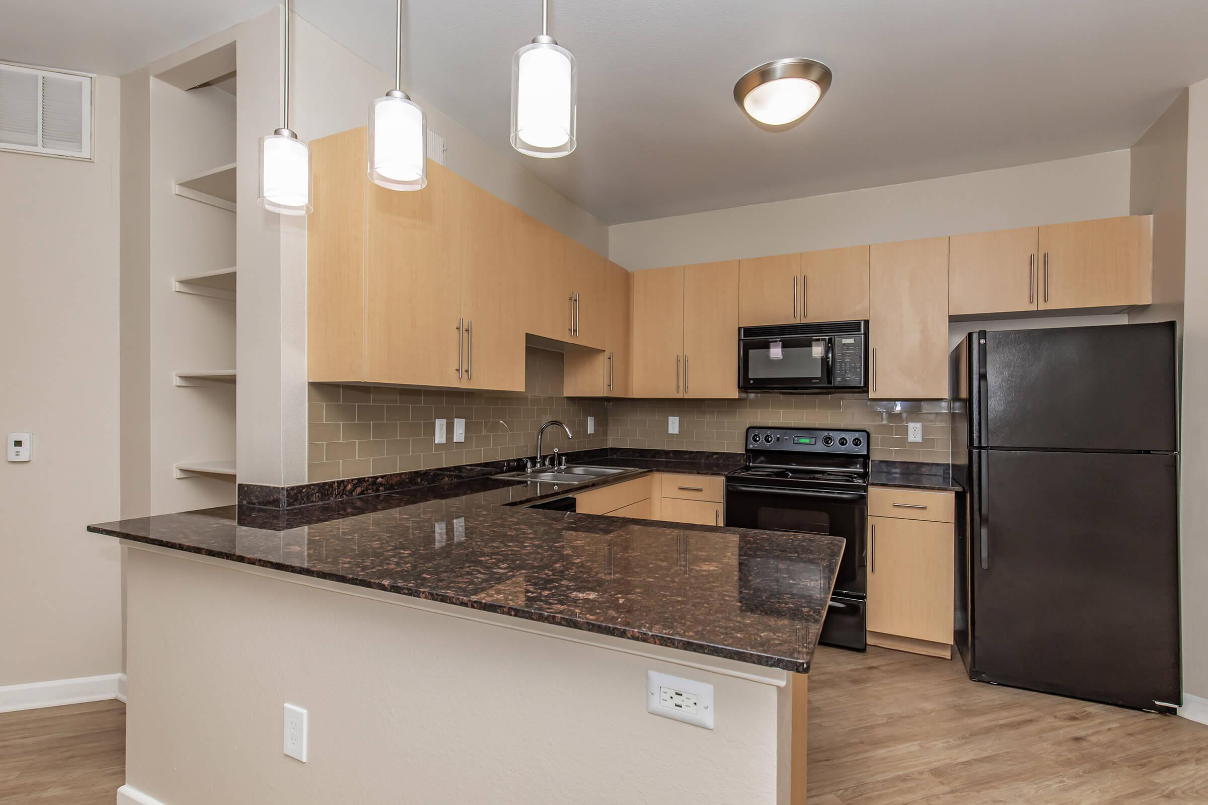 a modern kitchen with stainless steel appliances