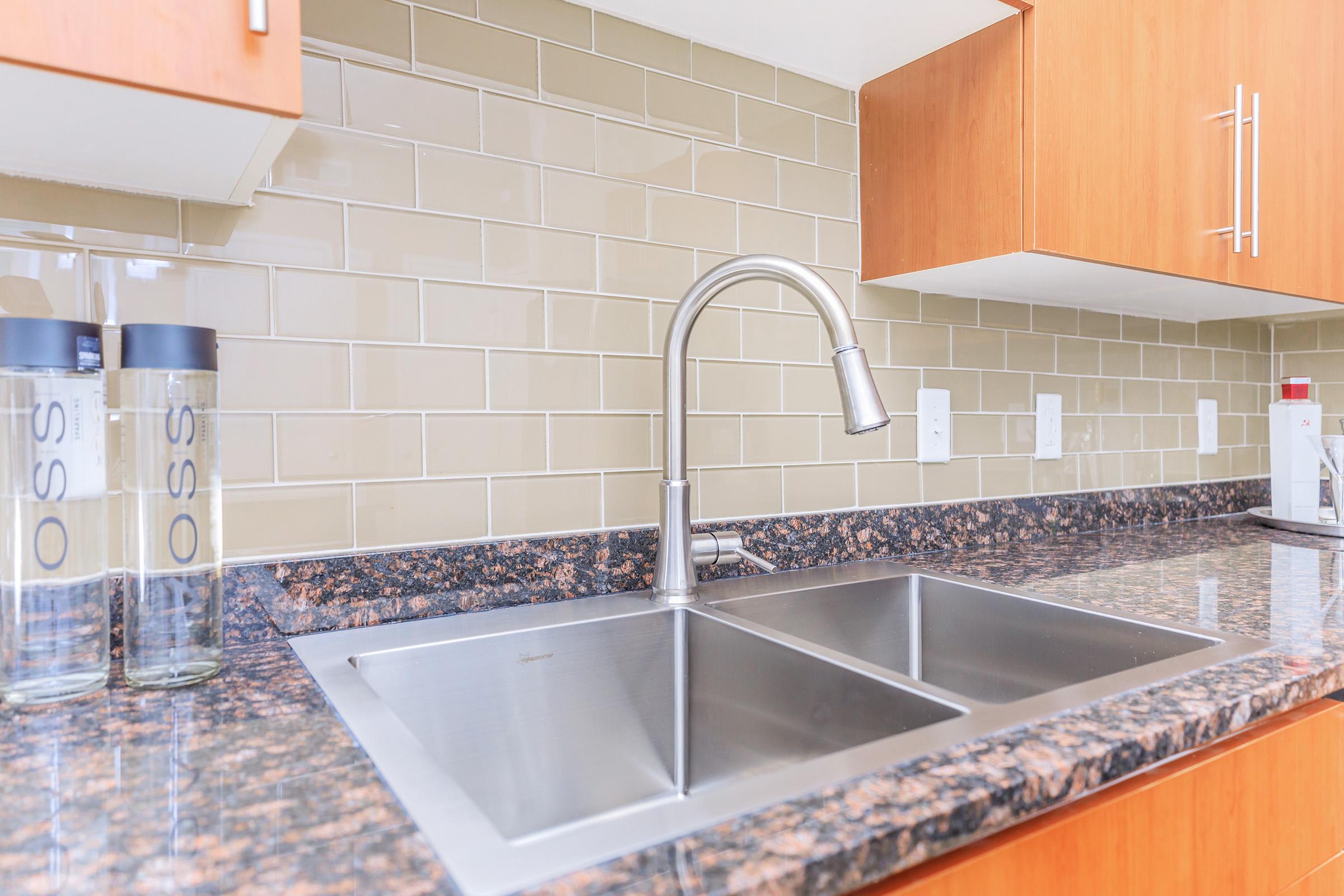 a kitchen with a sink and a counter