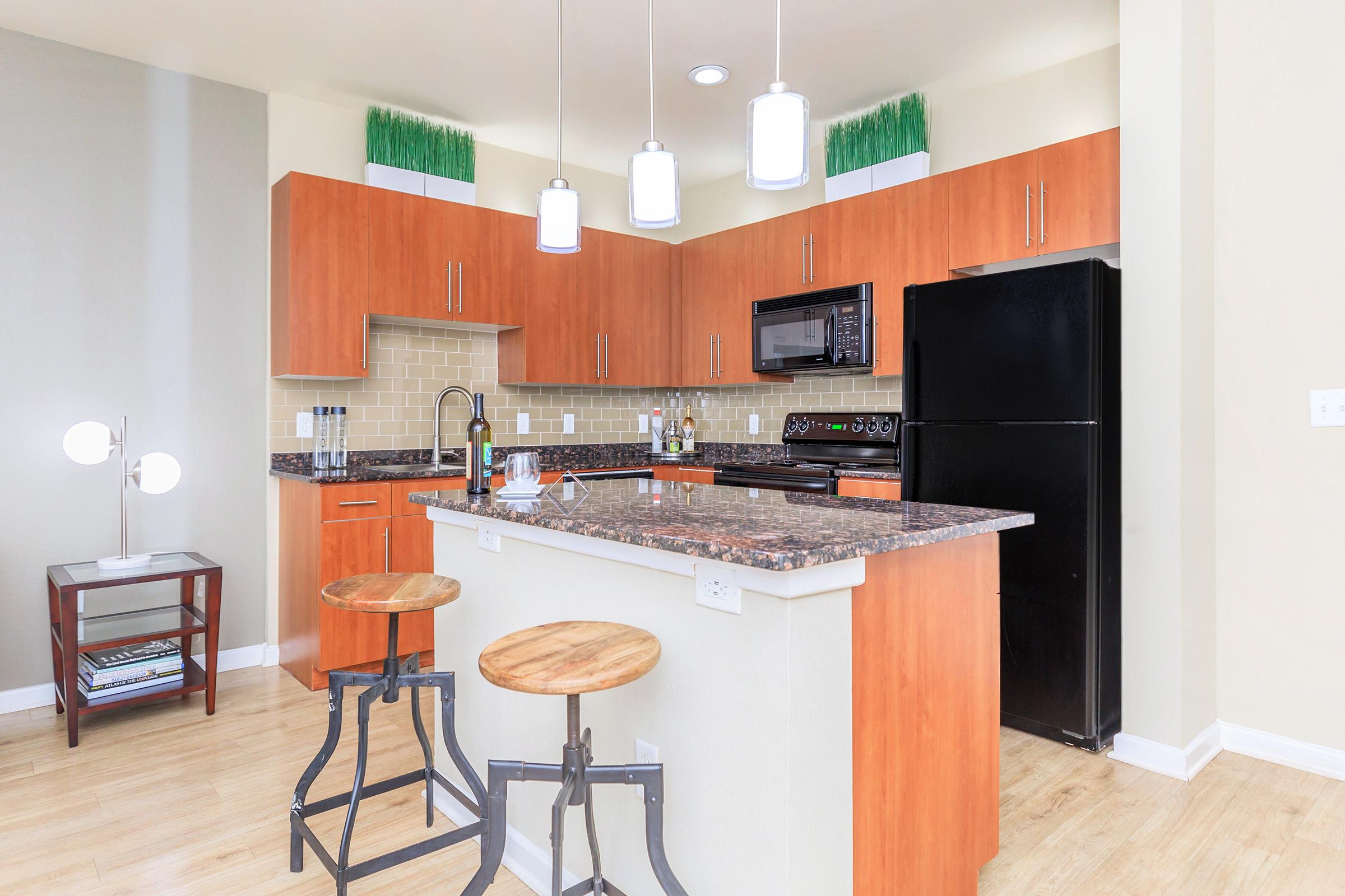 a kitchen with a wood floor