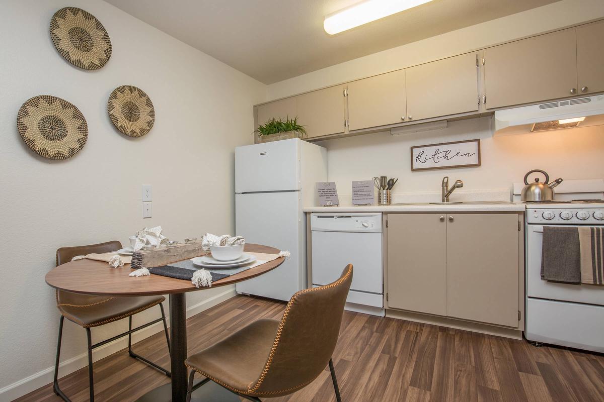 a kitchen with a table in a room