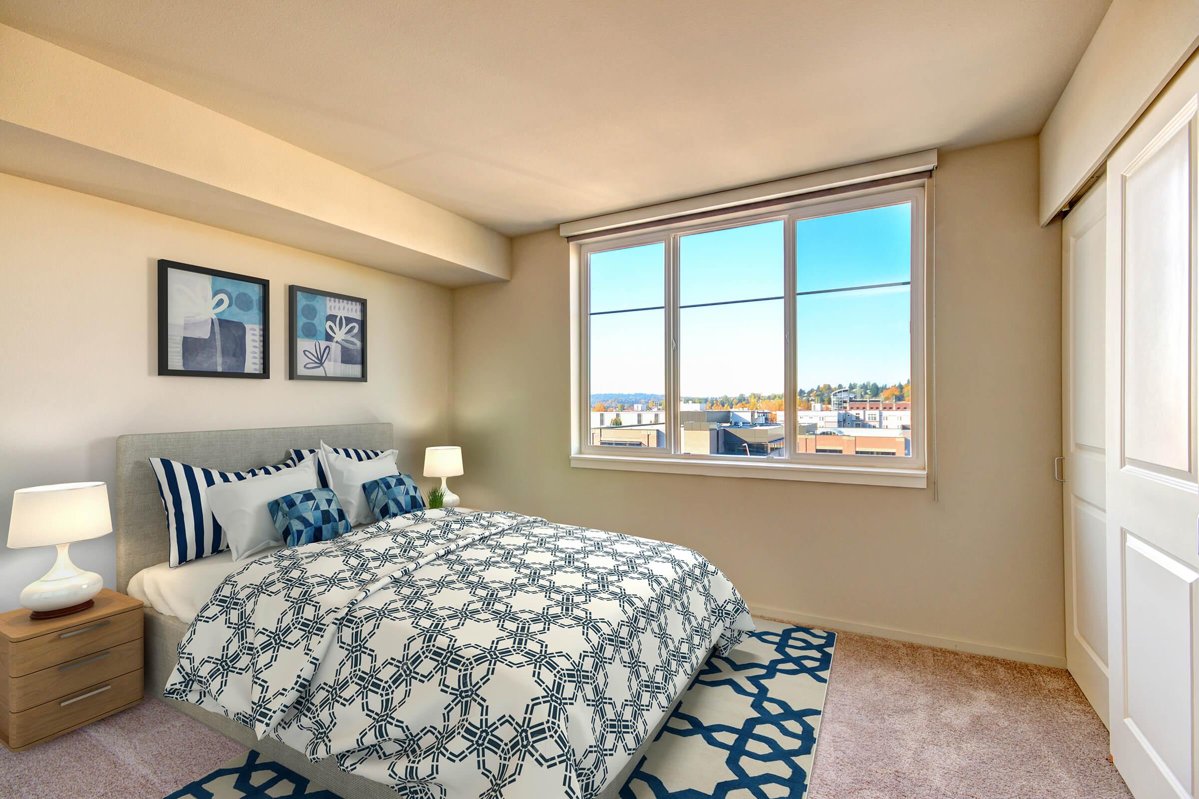 a bedroom with a bed and window in a room