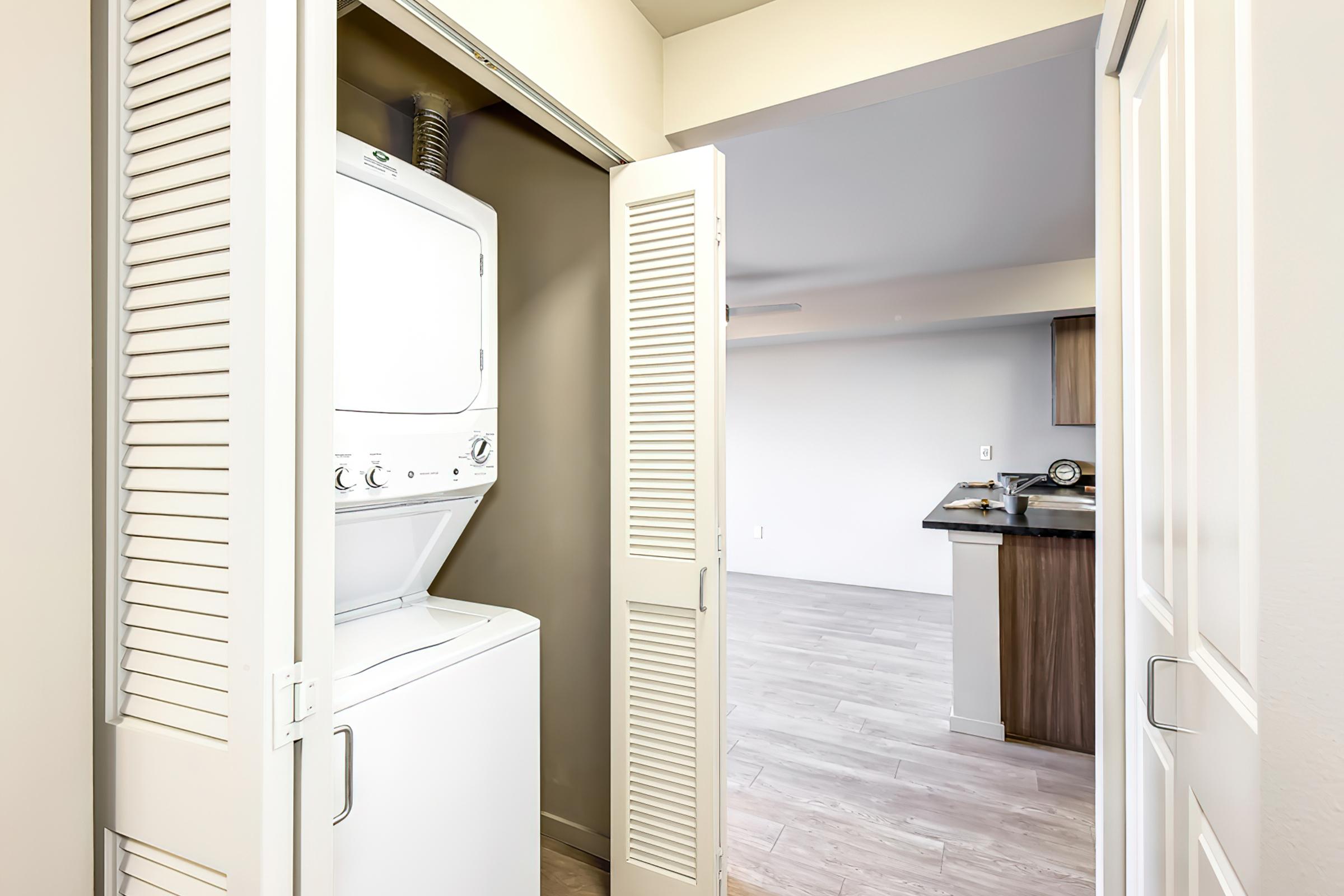 a refrigerator freezer sitting in a room