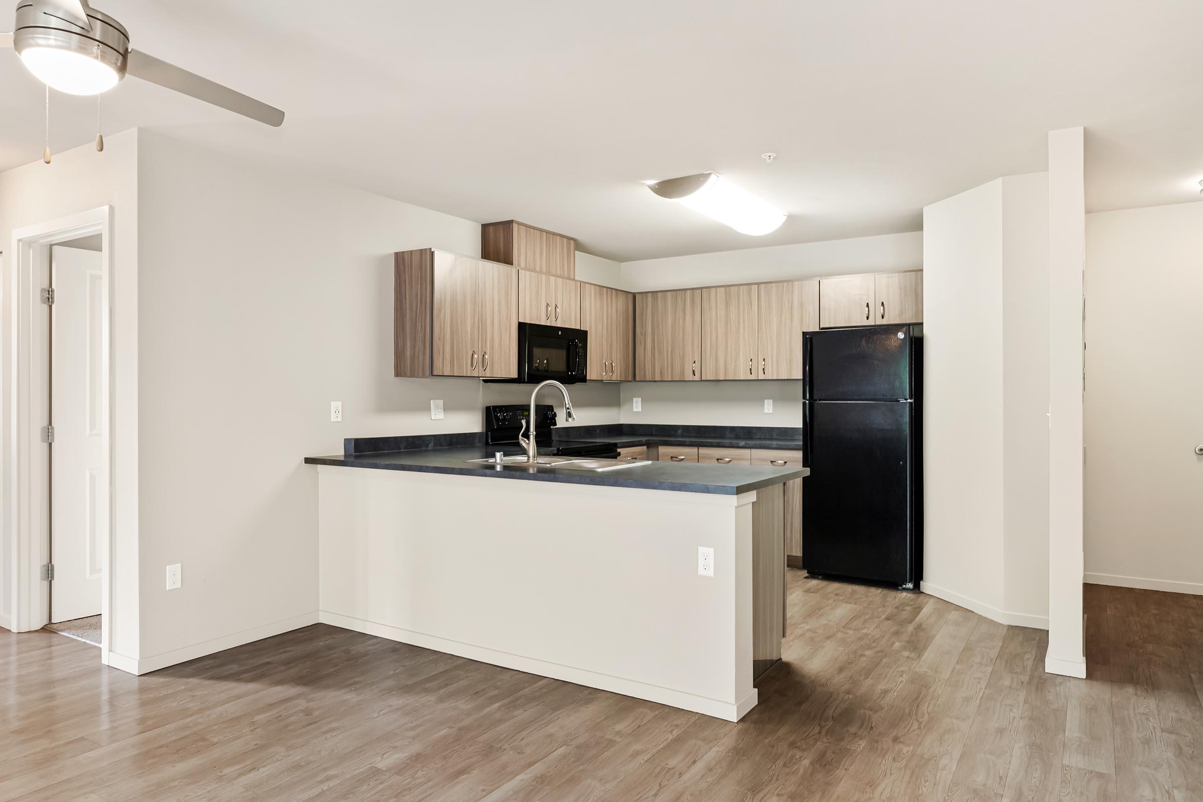 a kitchen with a wood floor