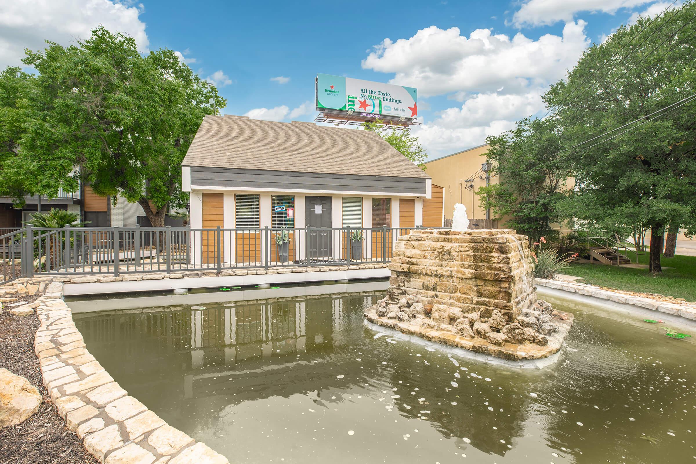 a small house surrounded by water