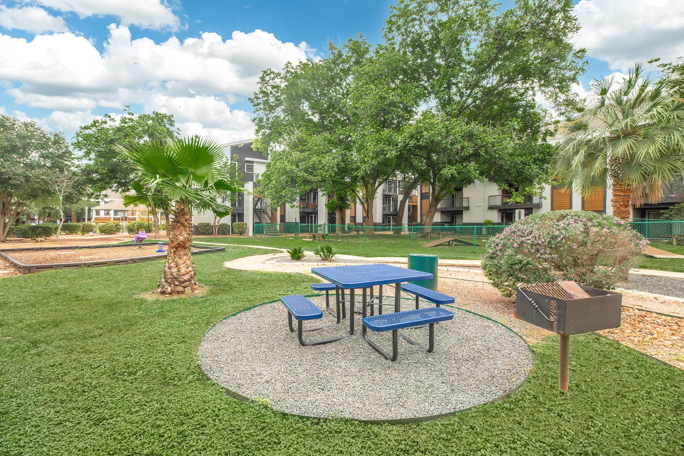 a group of lawn chairs sitting on top of a picnic table