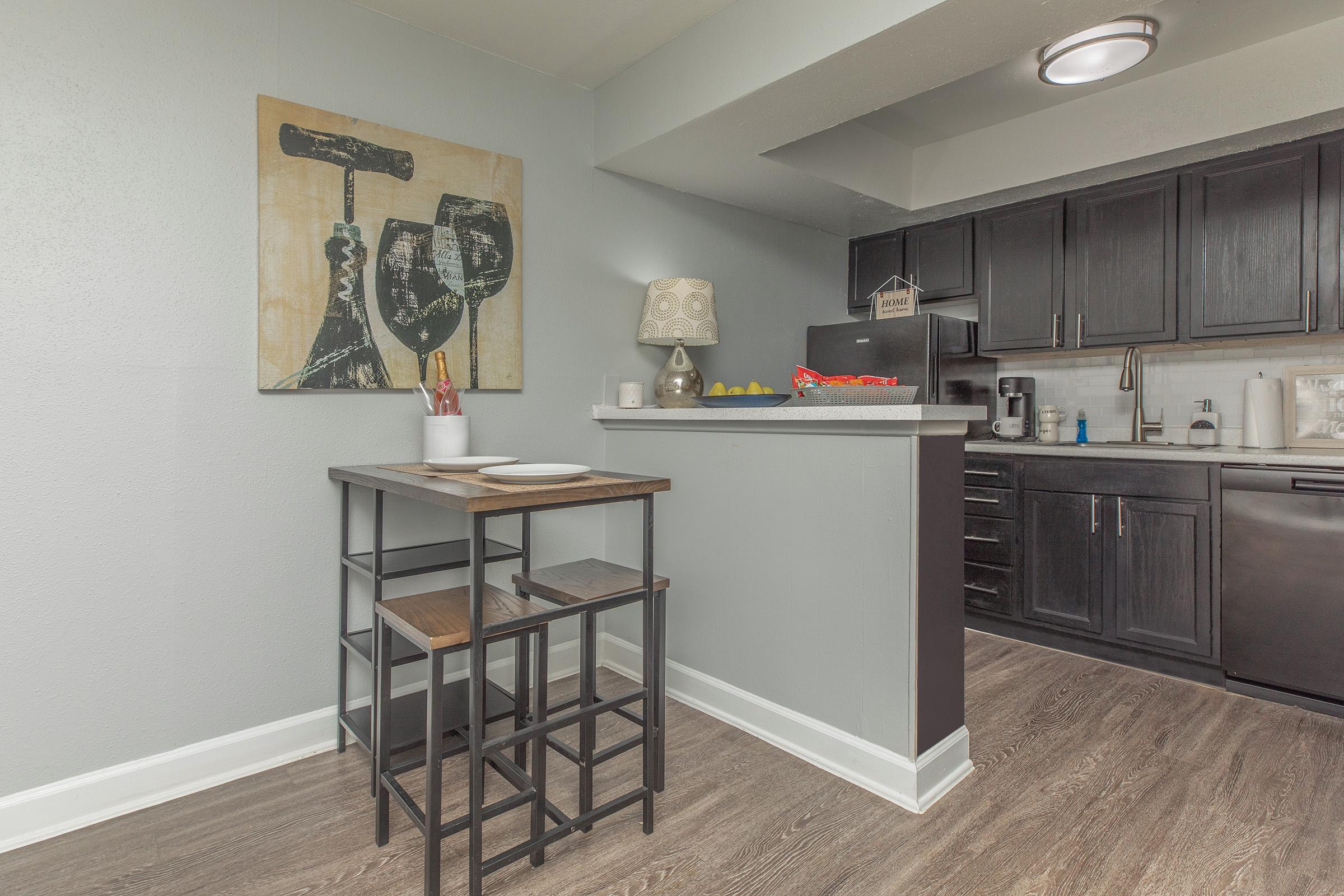 a kitchen with a table in a room