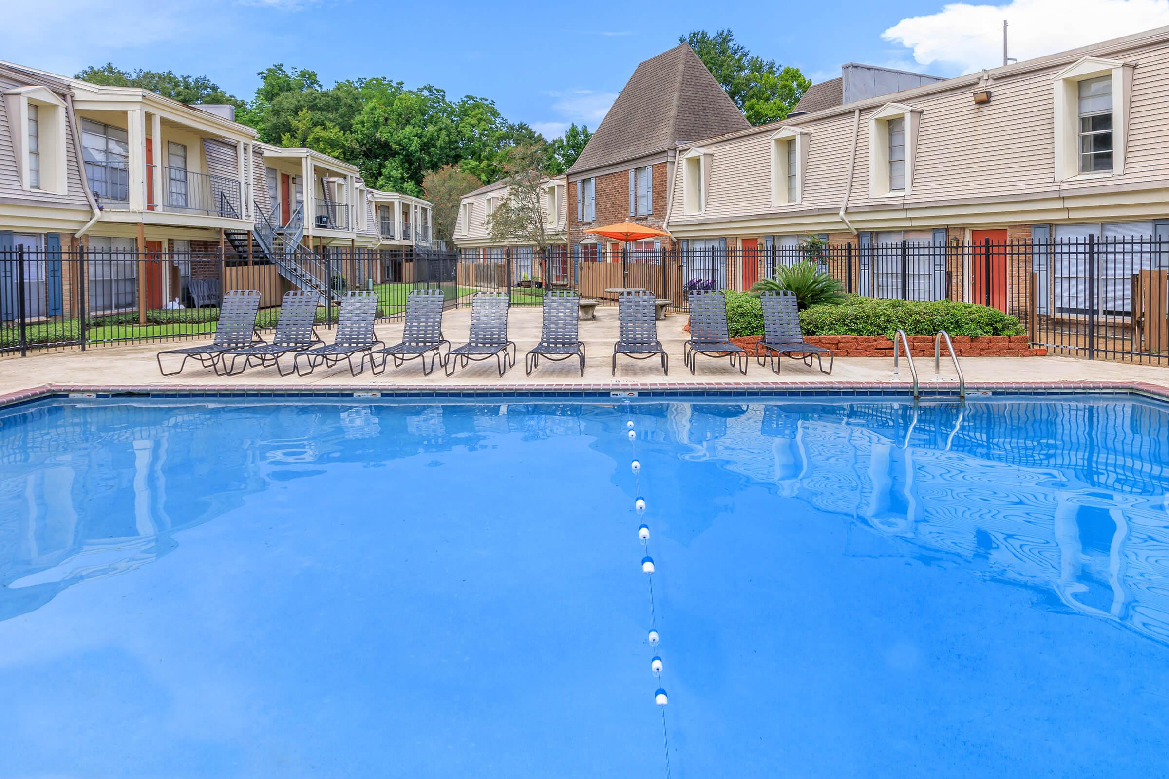 a large pool of water in front of a building