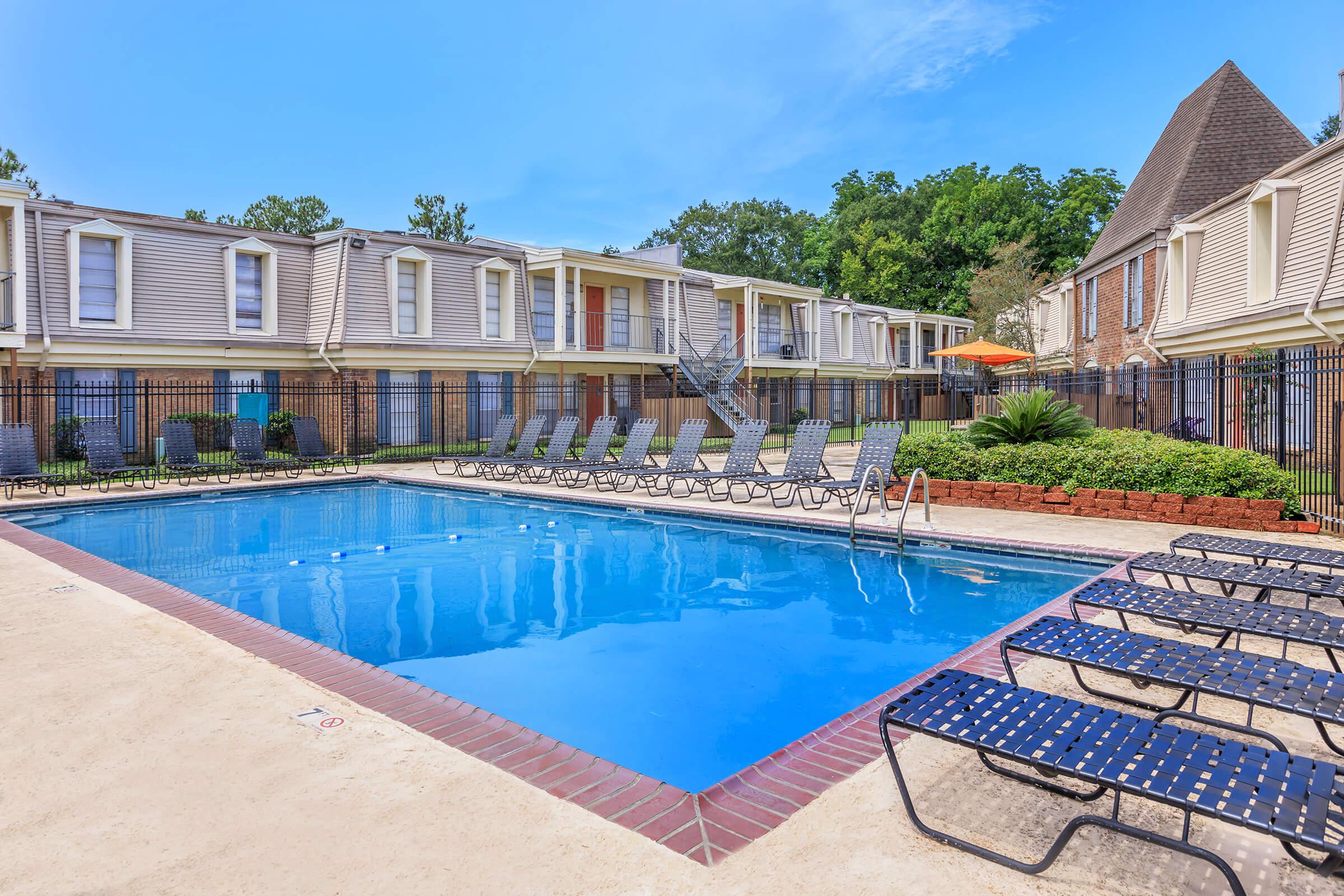 a large pool of water in front of a building