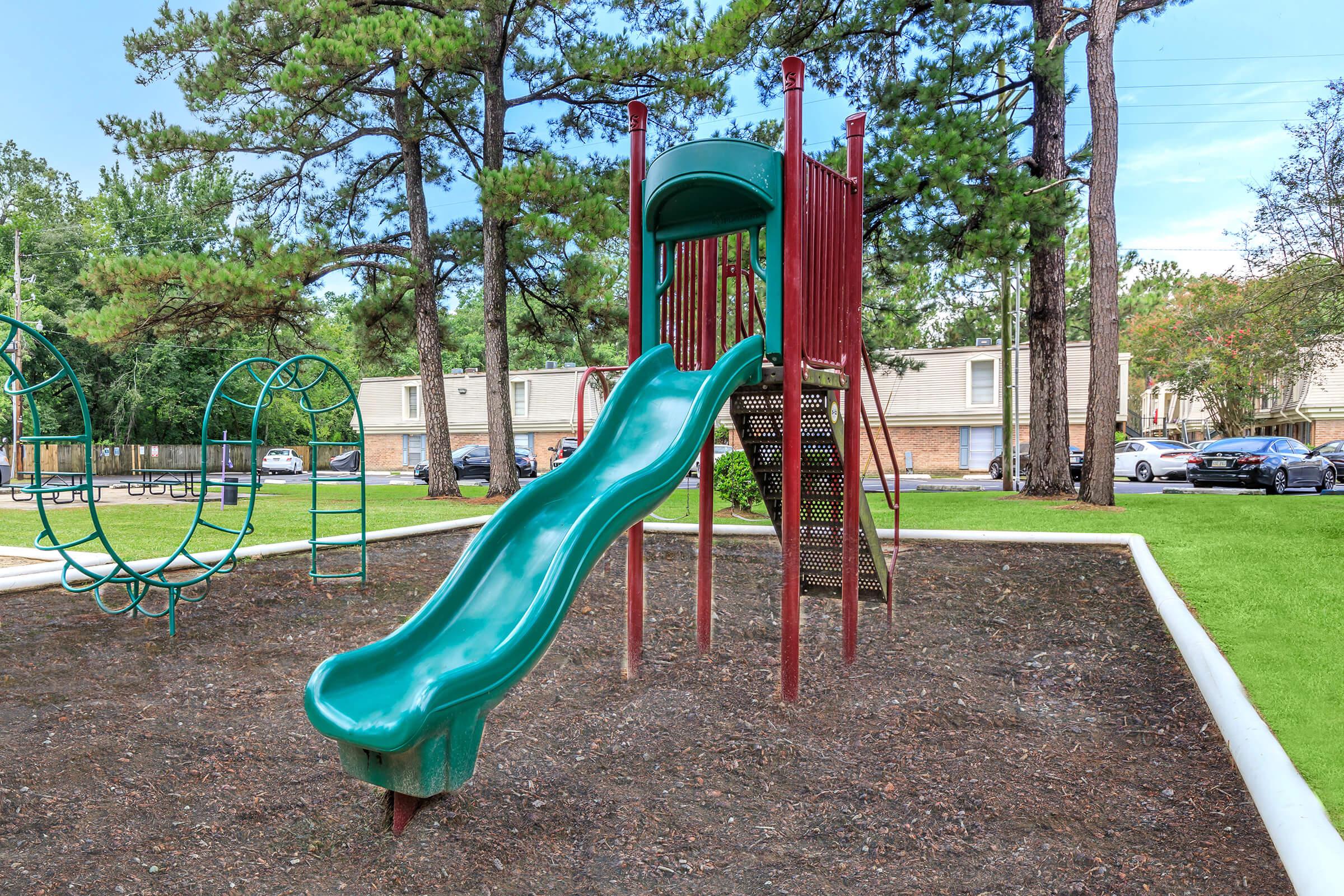 a green lawn chair on a playground