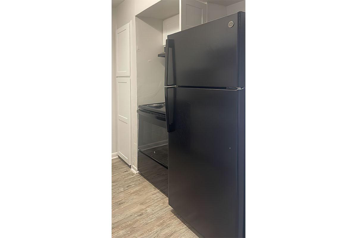 a stainless steel refrigerator in a room