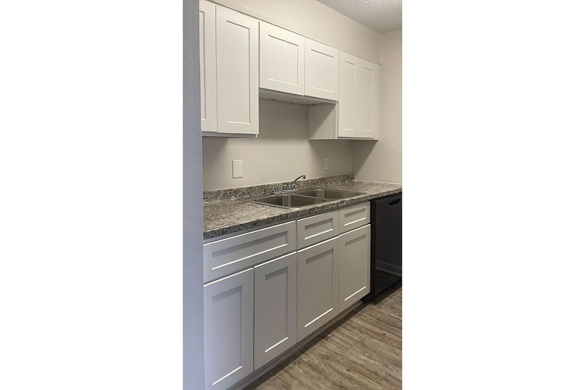 a stove top oven sitting inside of a kitchen