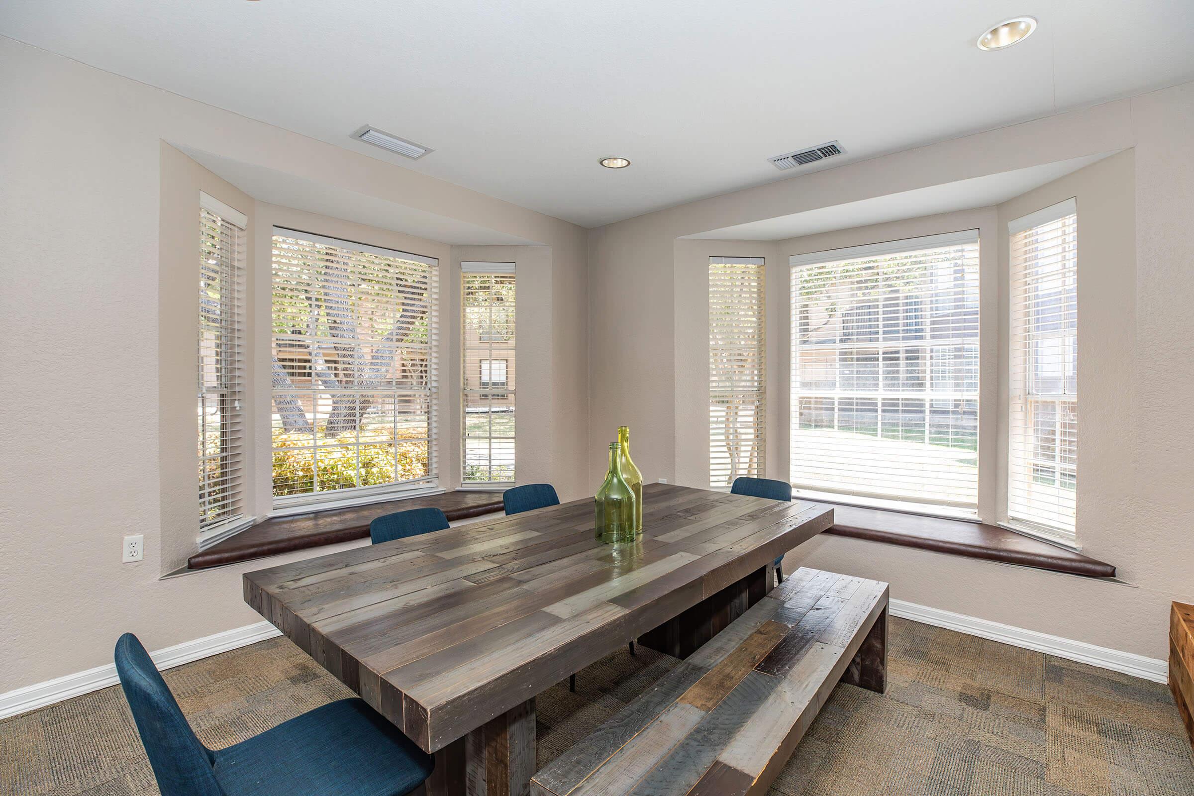 a living room filled with furniture and a large window