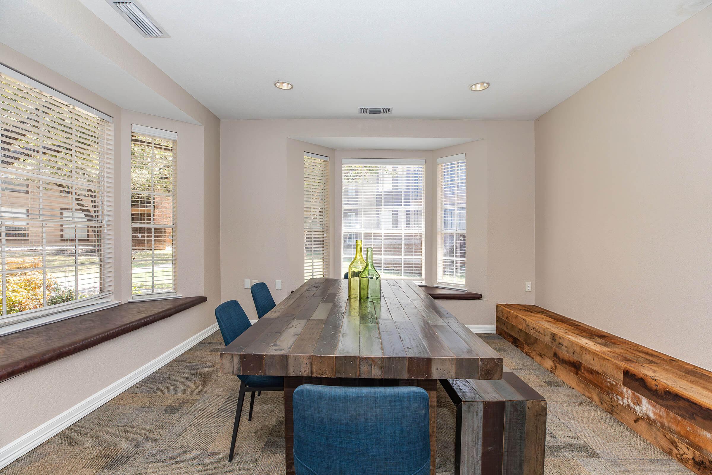 a living room filled with furniture and a large window