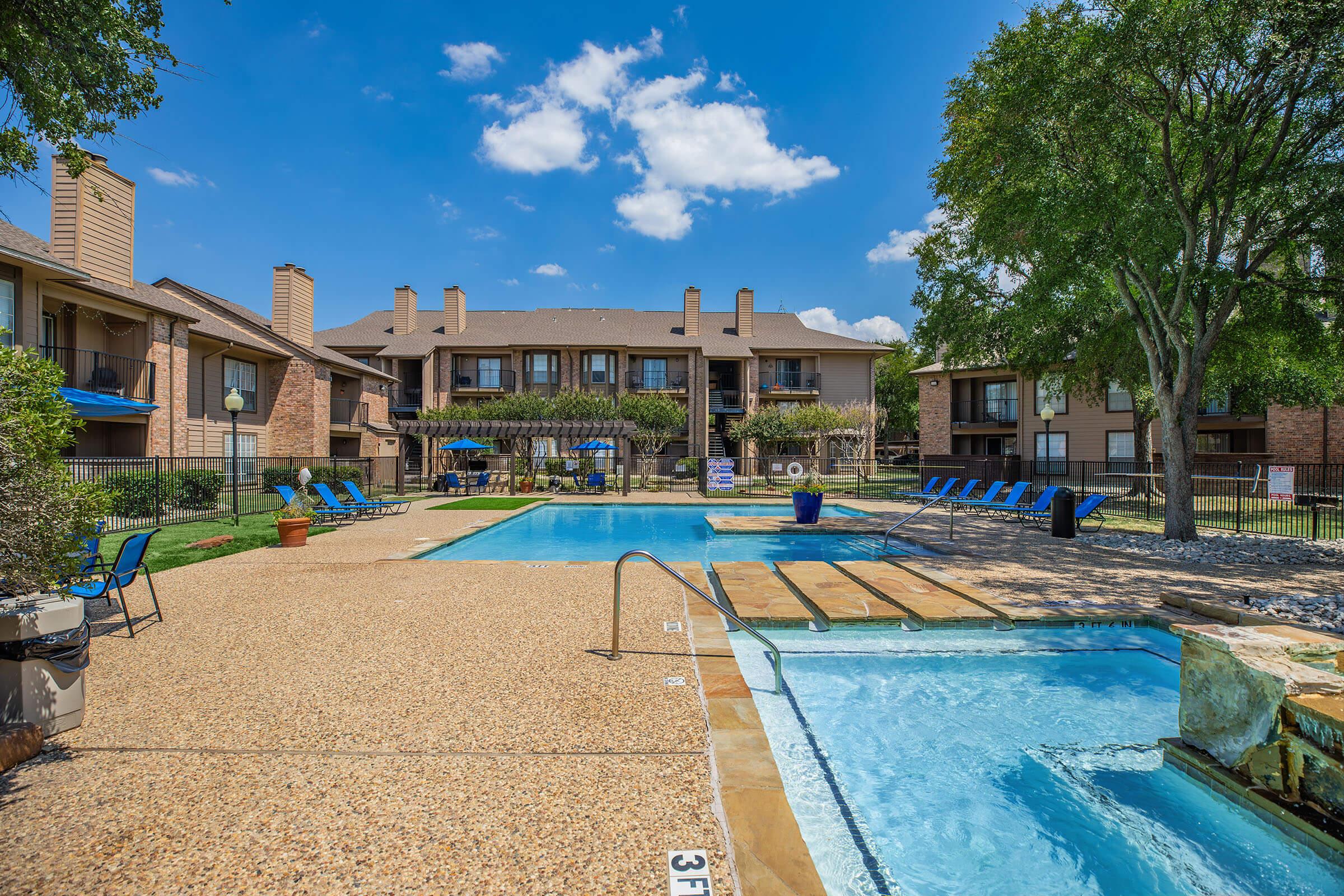 a pool in front of a building