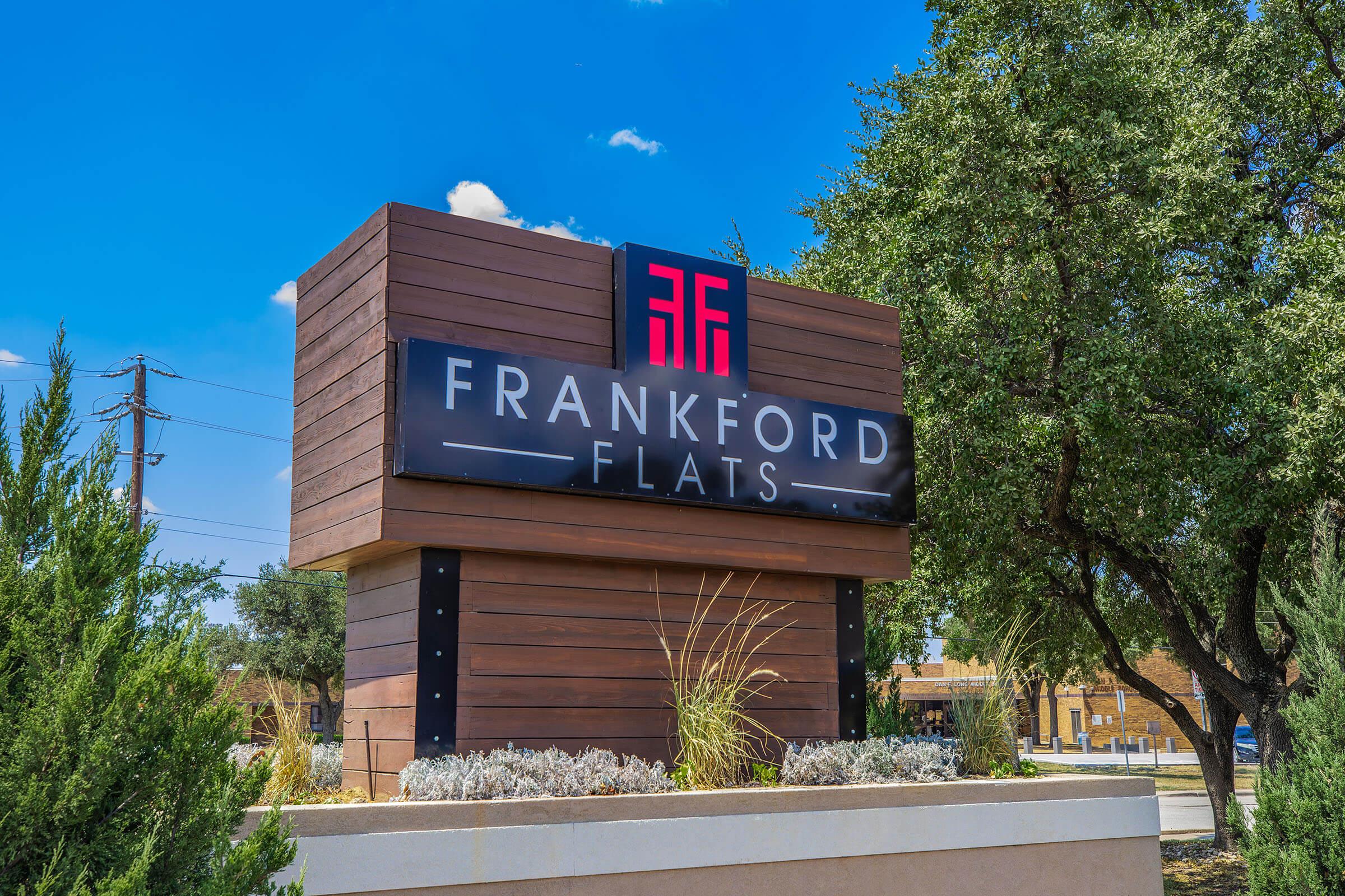 a sign in front of a building