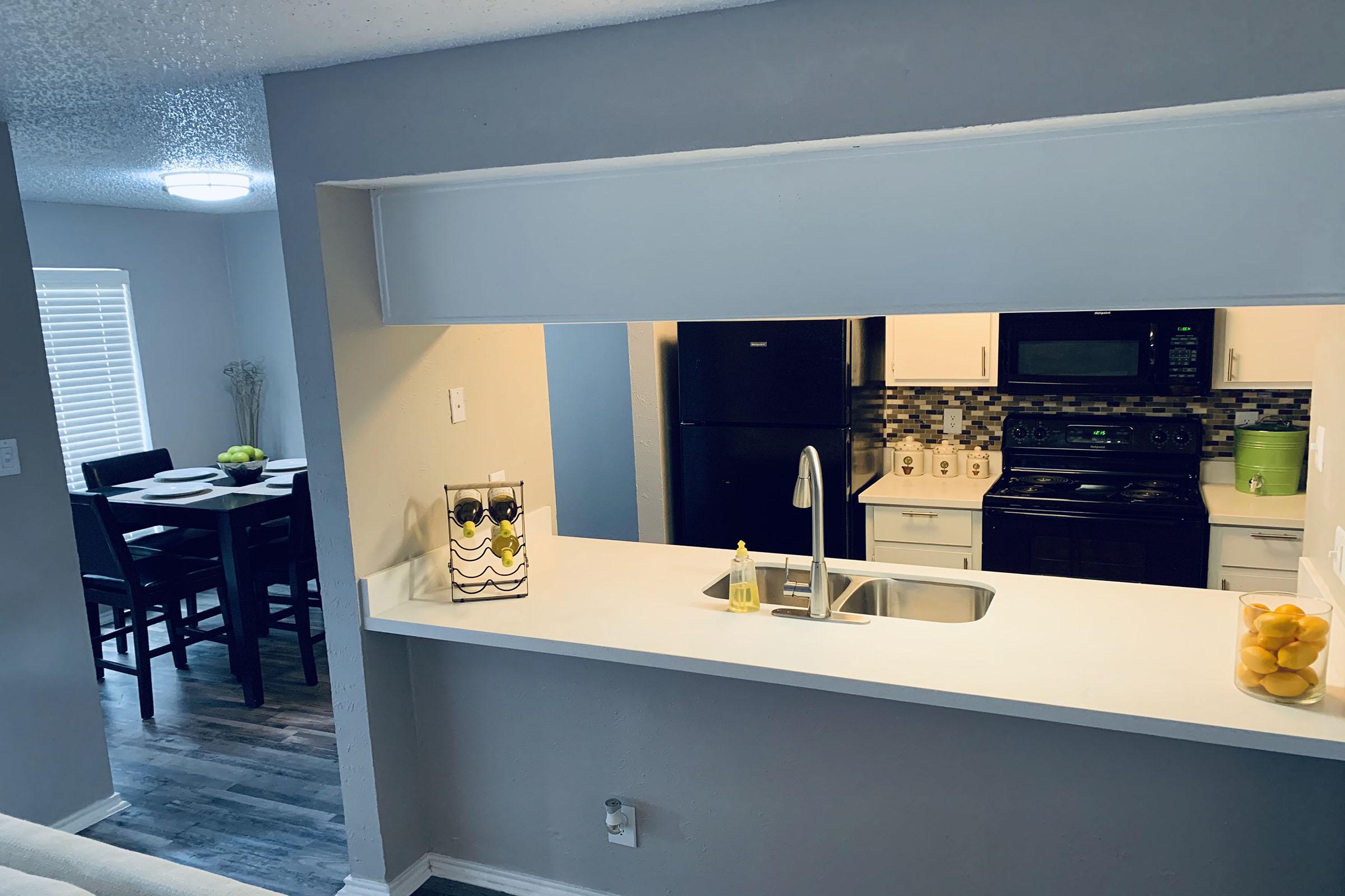 a kitchen with a sink and a window