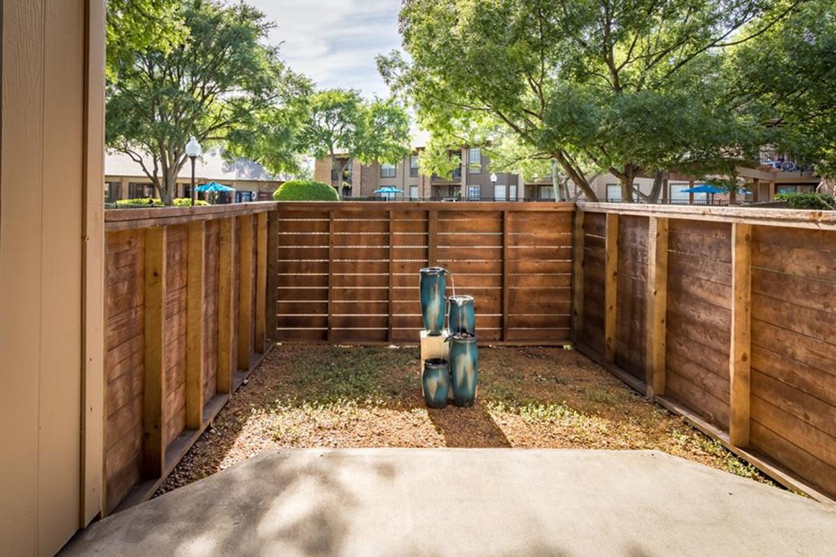 a wooden bench on the side of a building