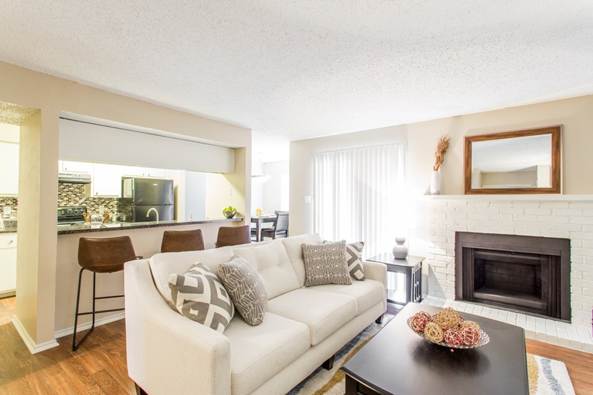 a living room filled with furniture and a flat screen tv