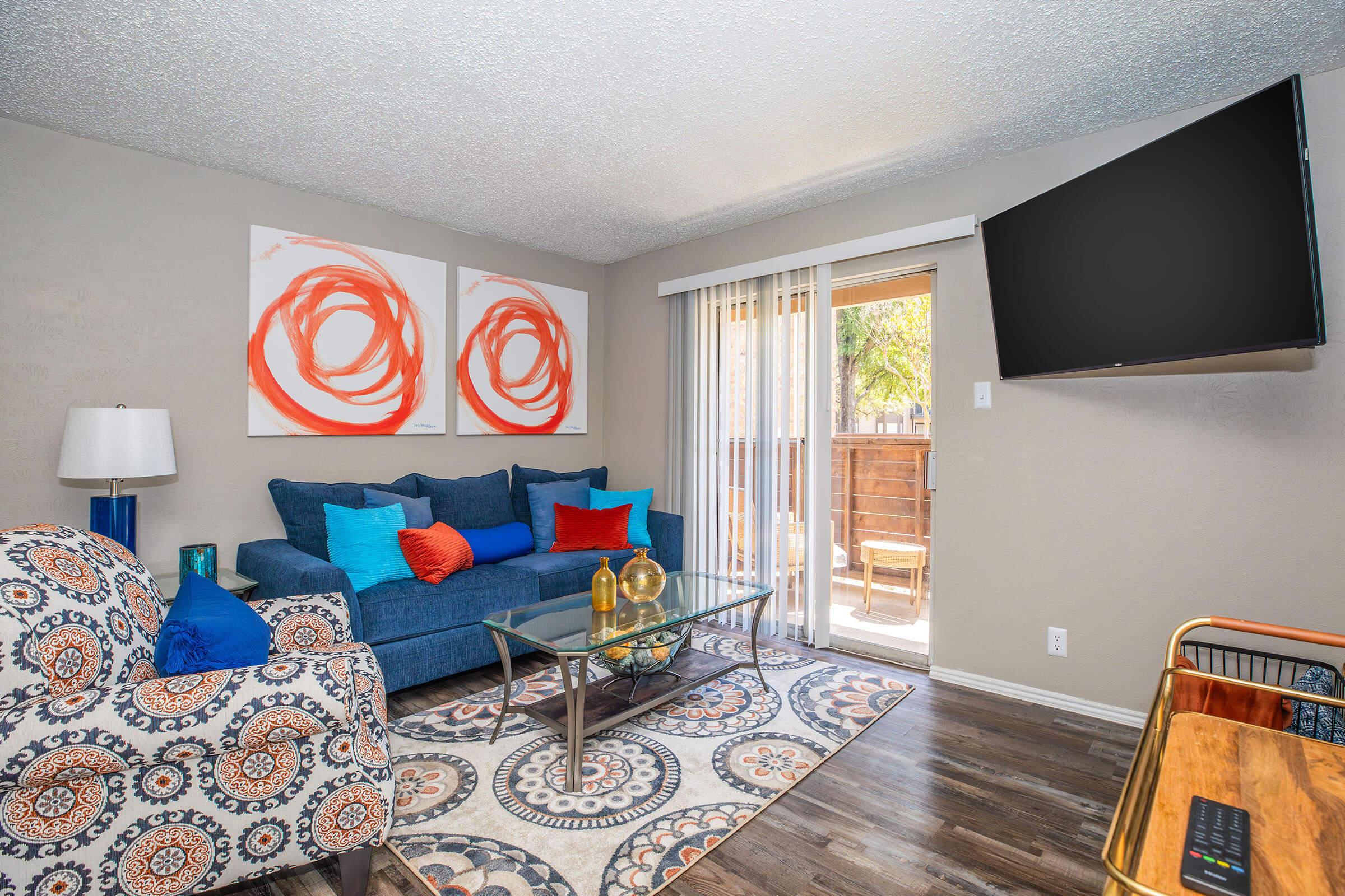 a living room filled with furniture and a fire place