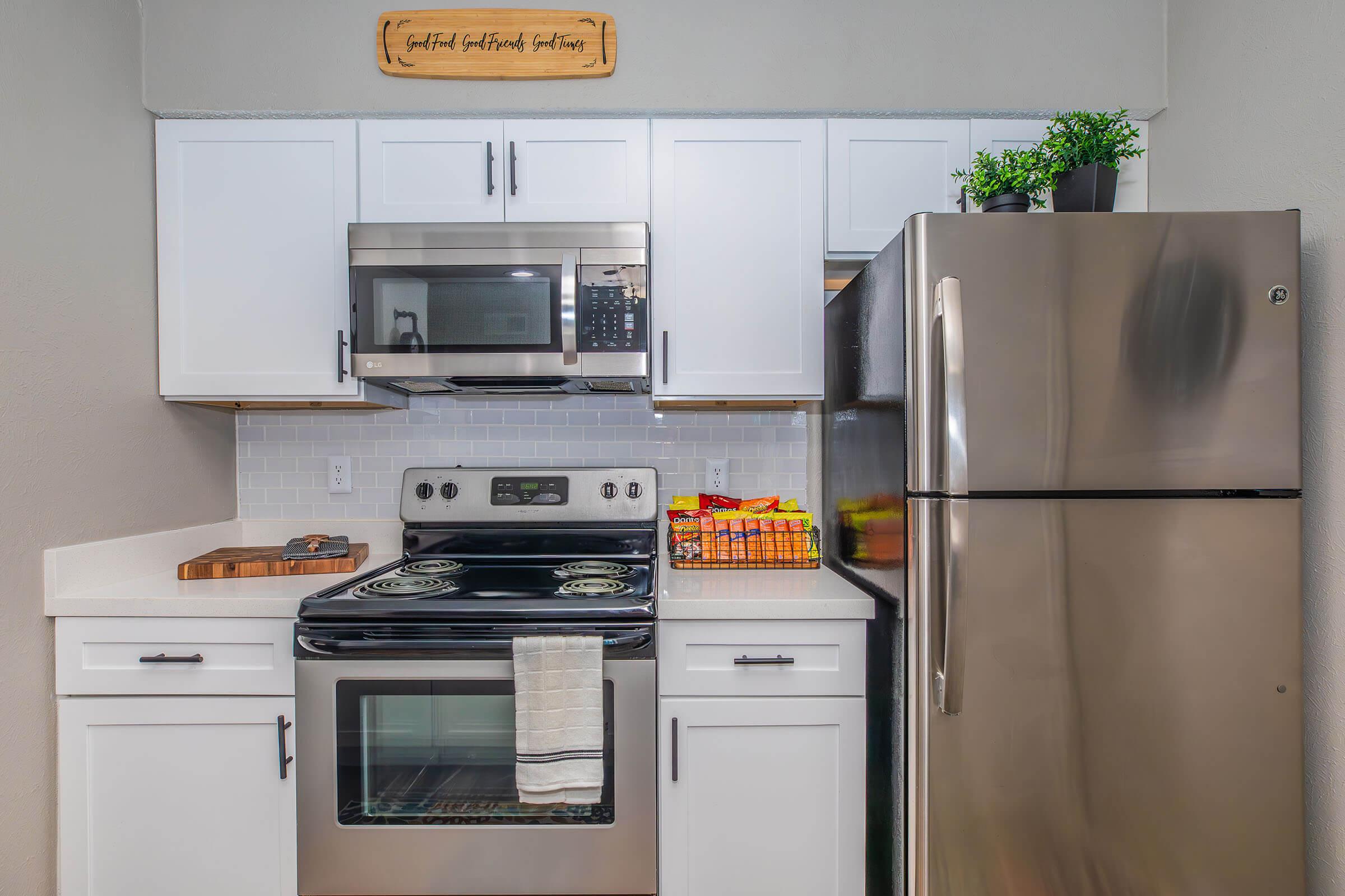 a kitchen with a stove top oven sitting inside of a refrigerator