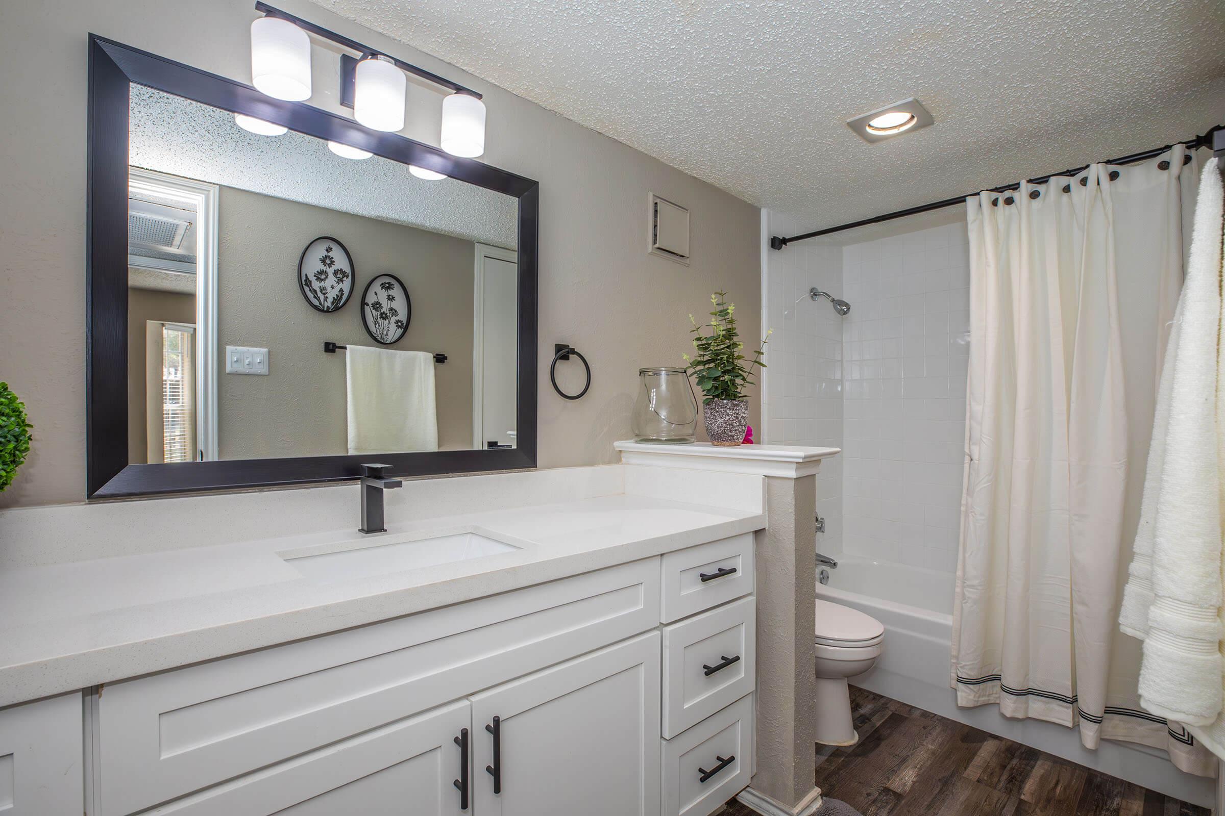 a bedroom with a large mirror