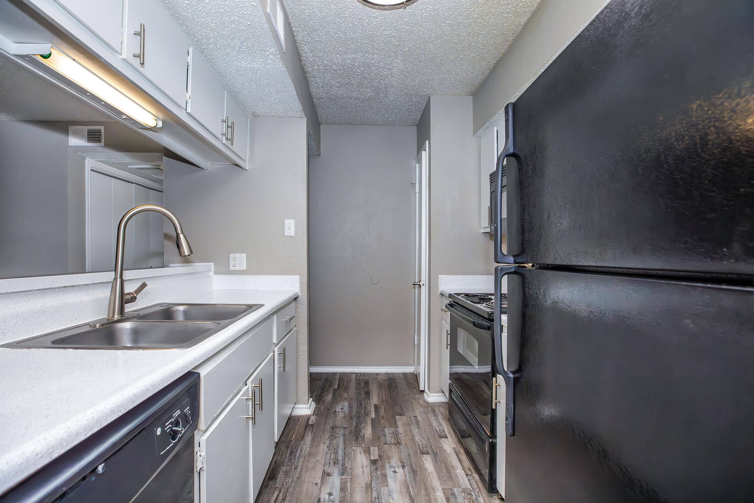 a large kitchen with stainless steel appliances