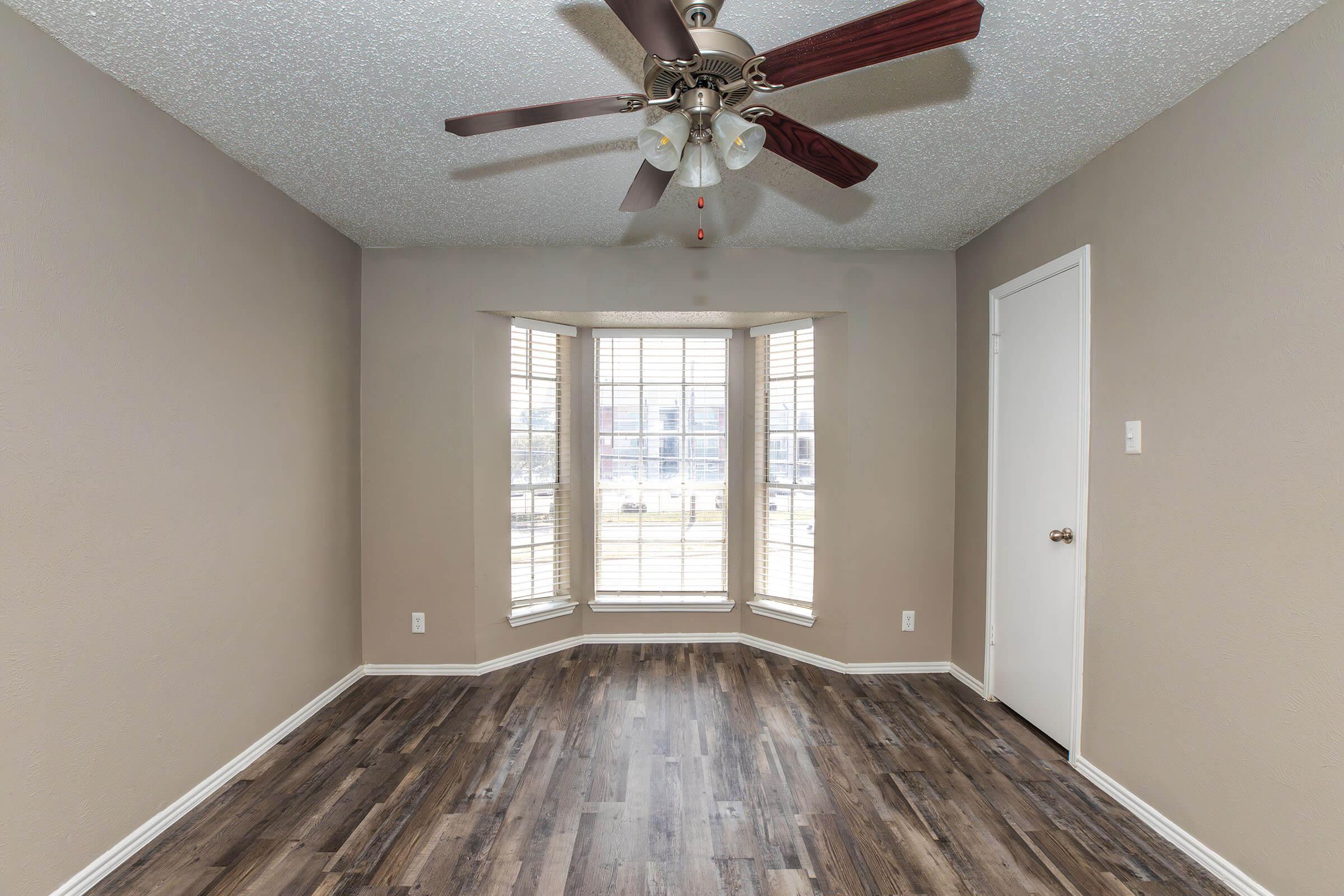 a bedroom with a large window