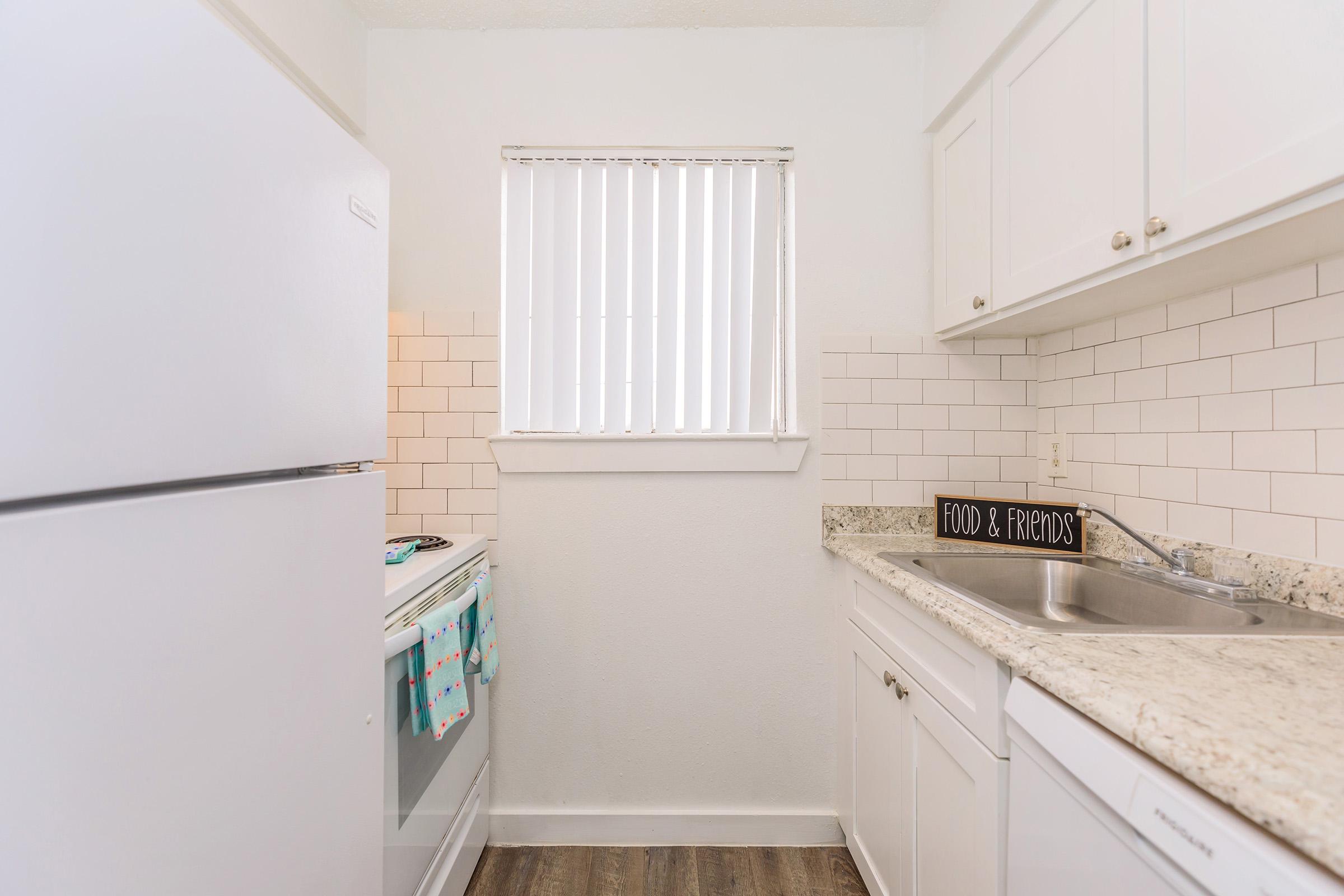 a kitchen with a stove and a refrigerator