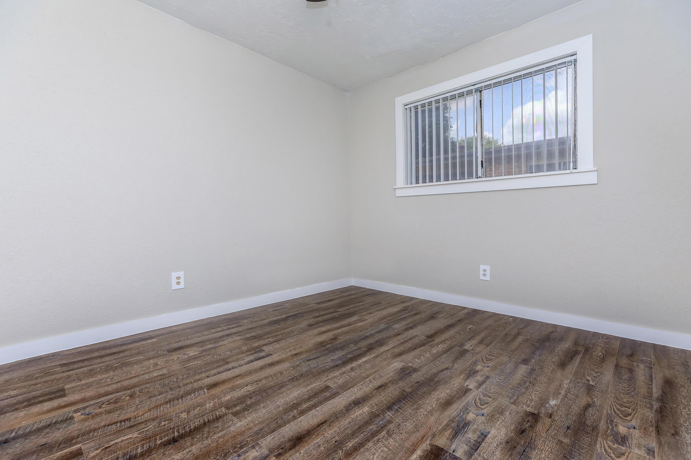 a bedroom with a large window