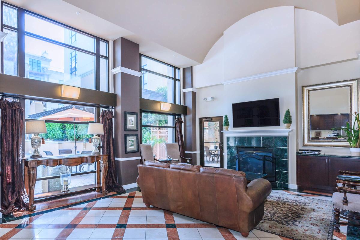 a living room filled with furniture and a large window