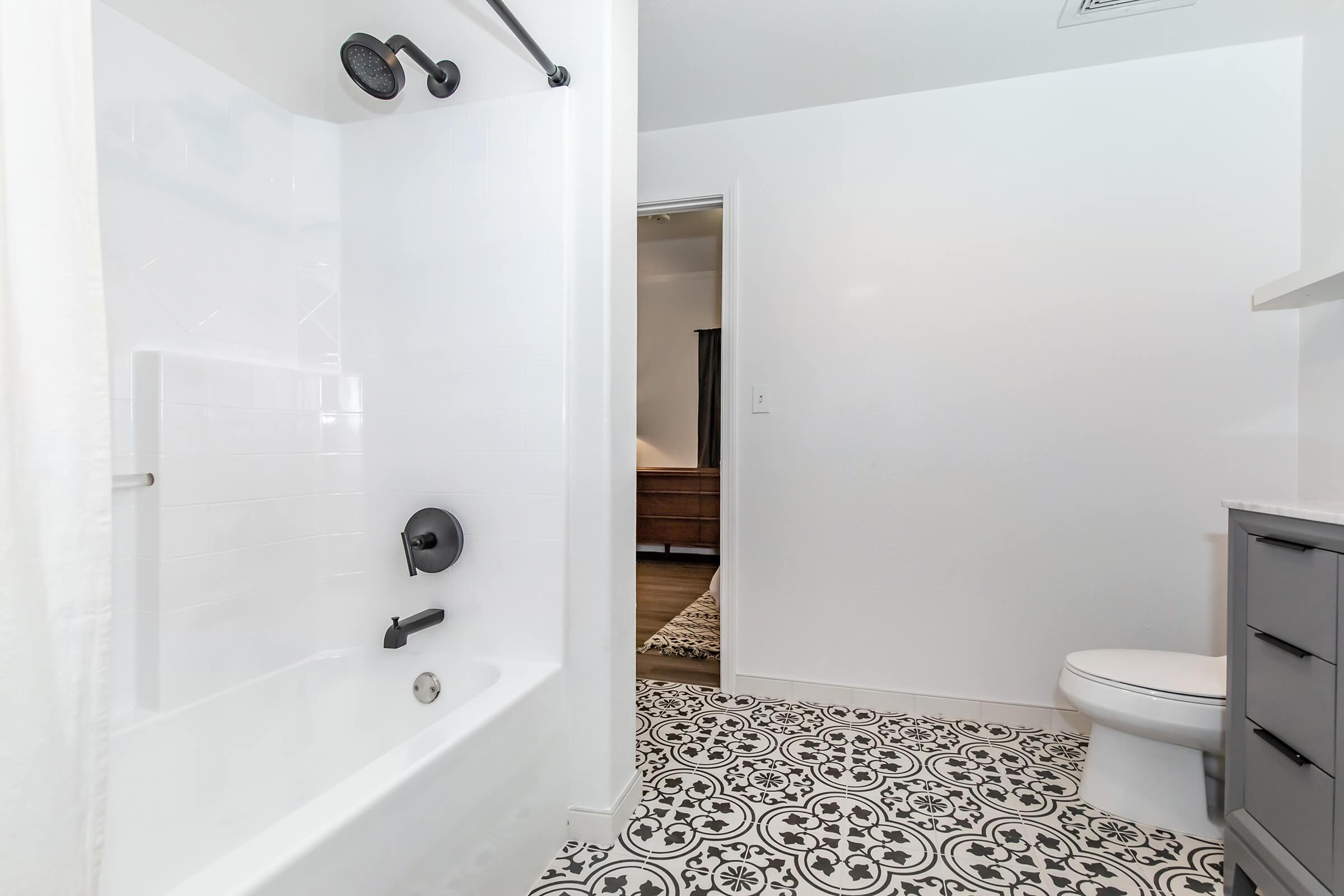 a room with a sink and a mirror