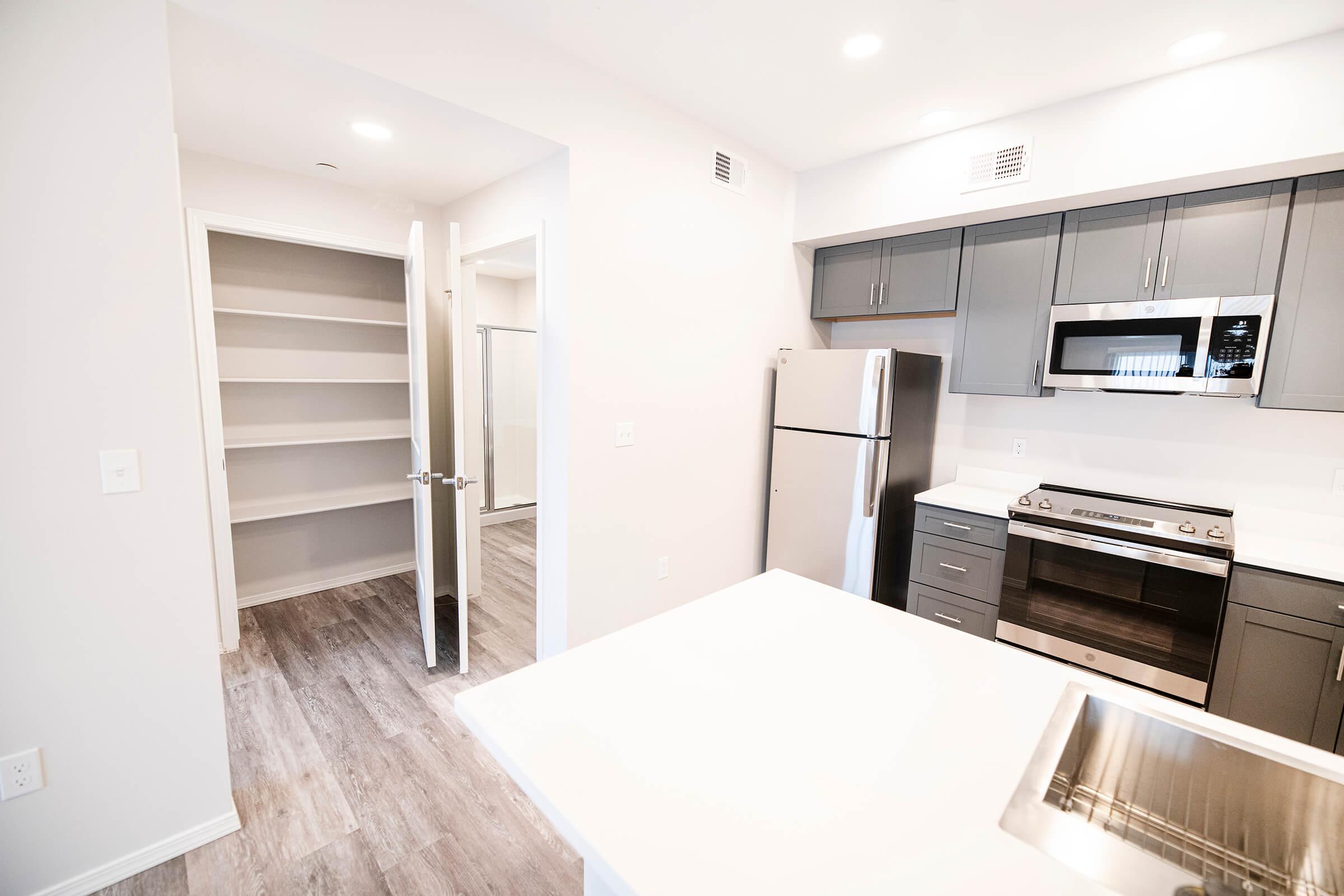 a kitchen with a table in a room
