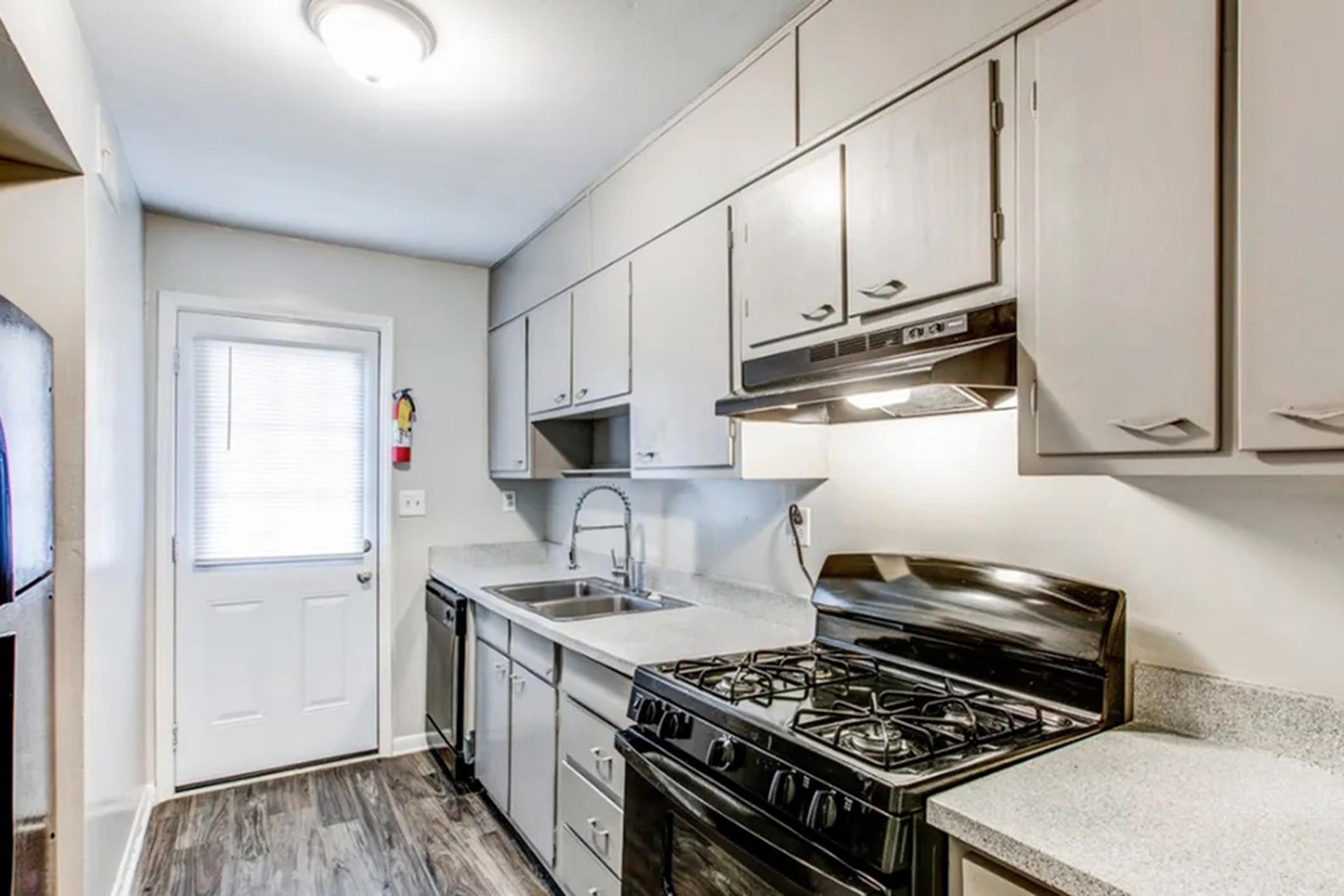 a kitchen with a stove top oven