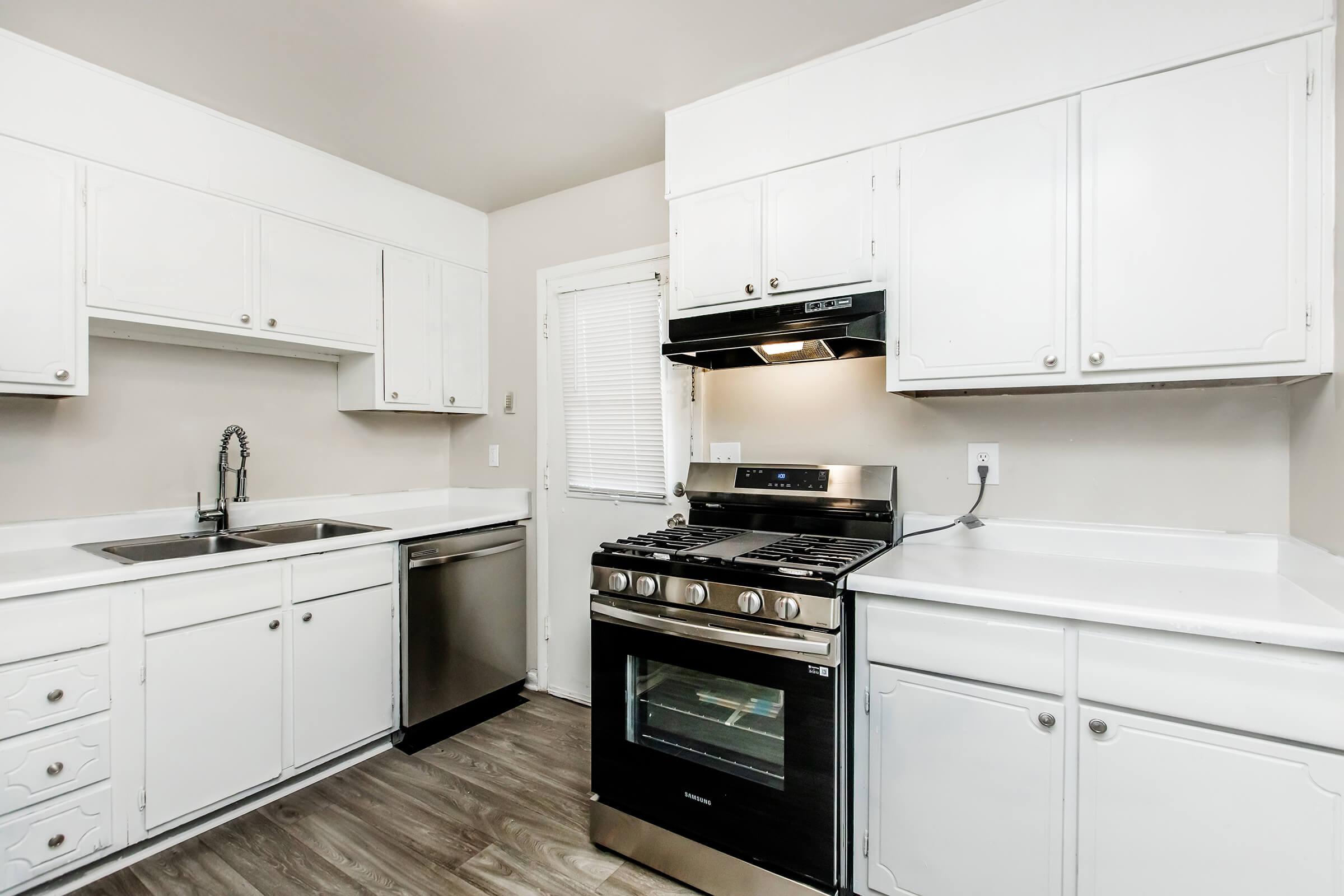 a kitchen with a stove top oven